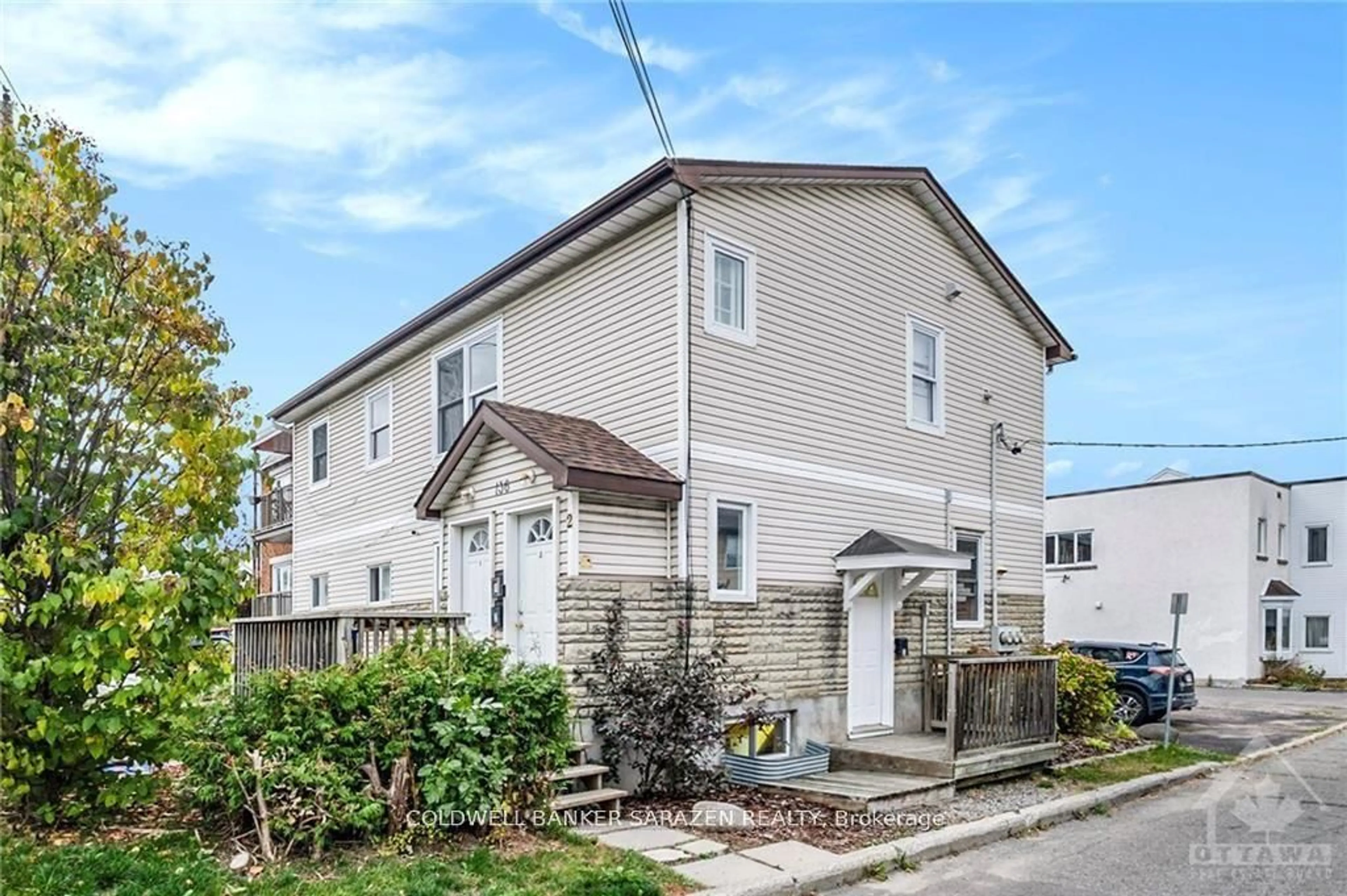 Home with vinyl exterior material, street for 136 Deschamps Ave, Ottawa Ontario K1L 5Z6