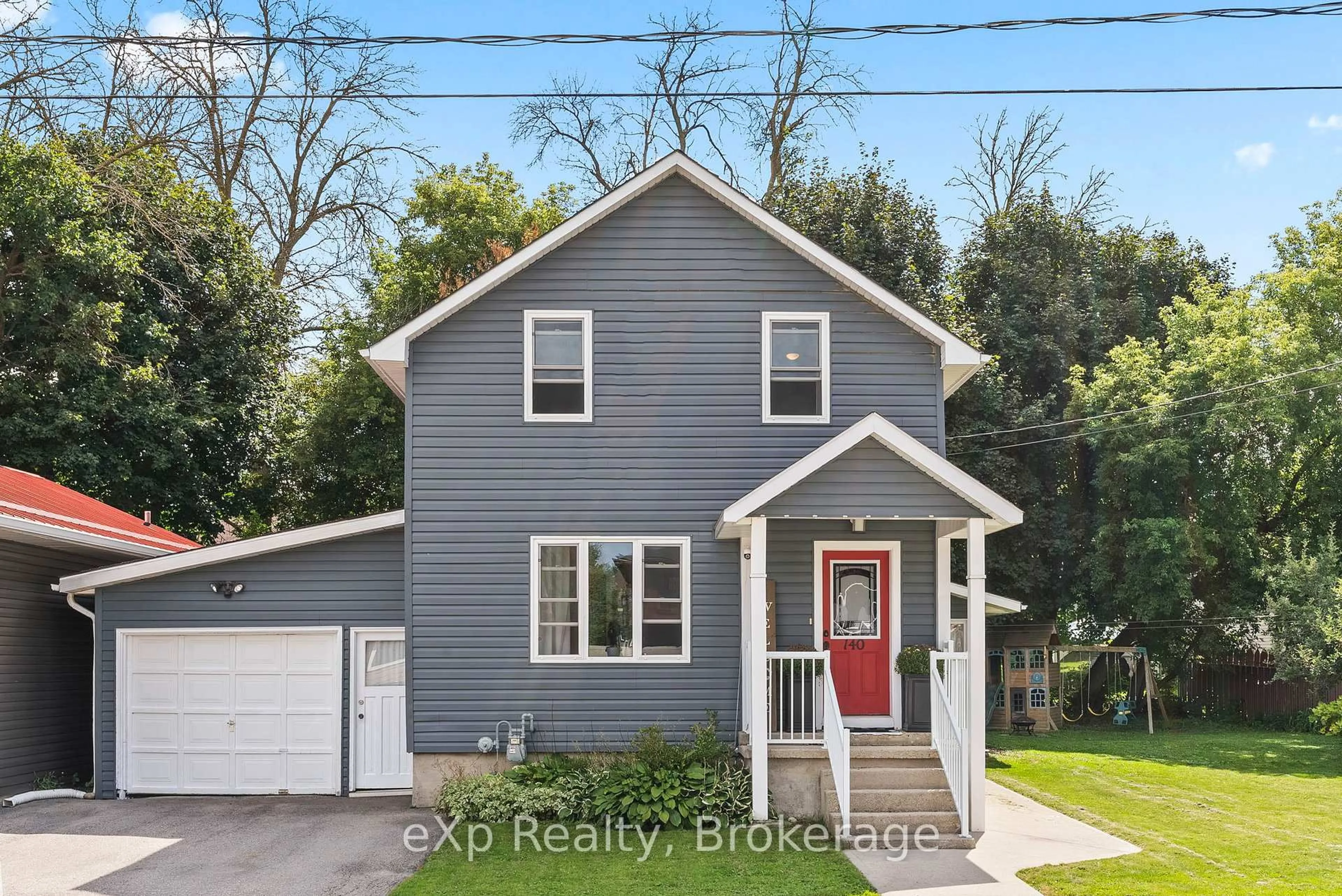 Home with vinyl exterior material, street for 140 KING St, Wellington North Ontario N0G 2L2
