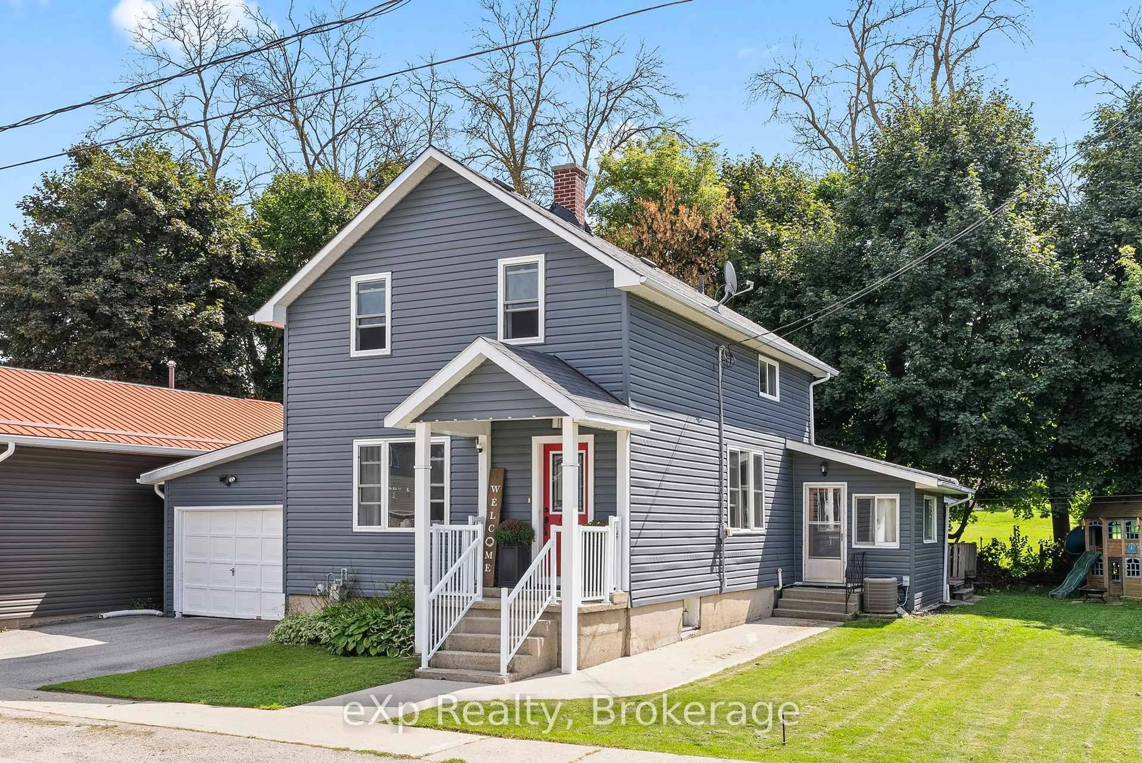 Home with vinyl exterior material, street for 140 KING St, Wellington North Ontario N0G 2L2