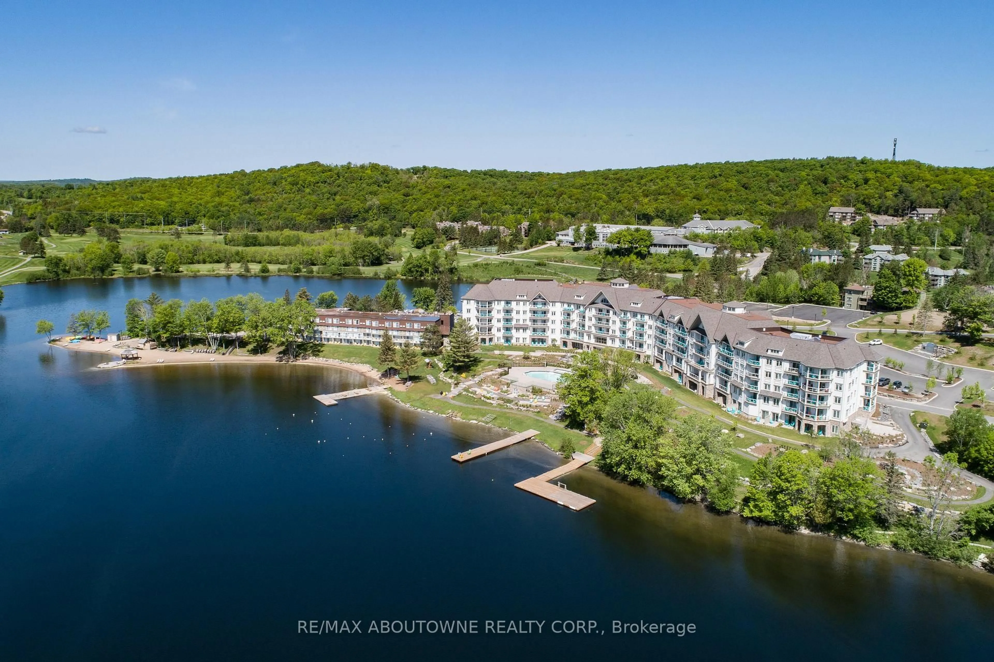 A pic from outside/outdoor area/front of a property/back of a property/a pic from drone, water/lake/river/ocean view for 25 PEN LAKE POINT Rd #332, Huntsville Ontario P1H 1A9