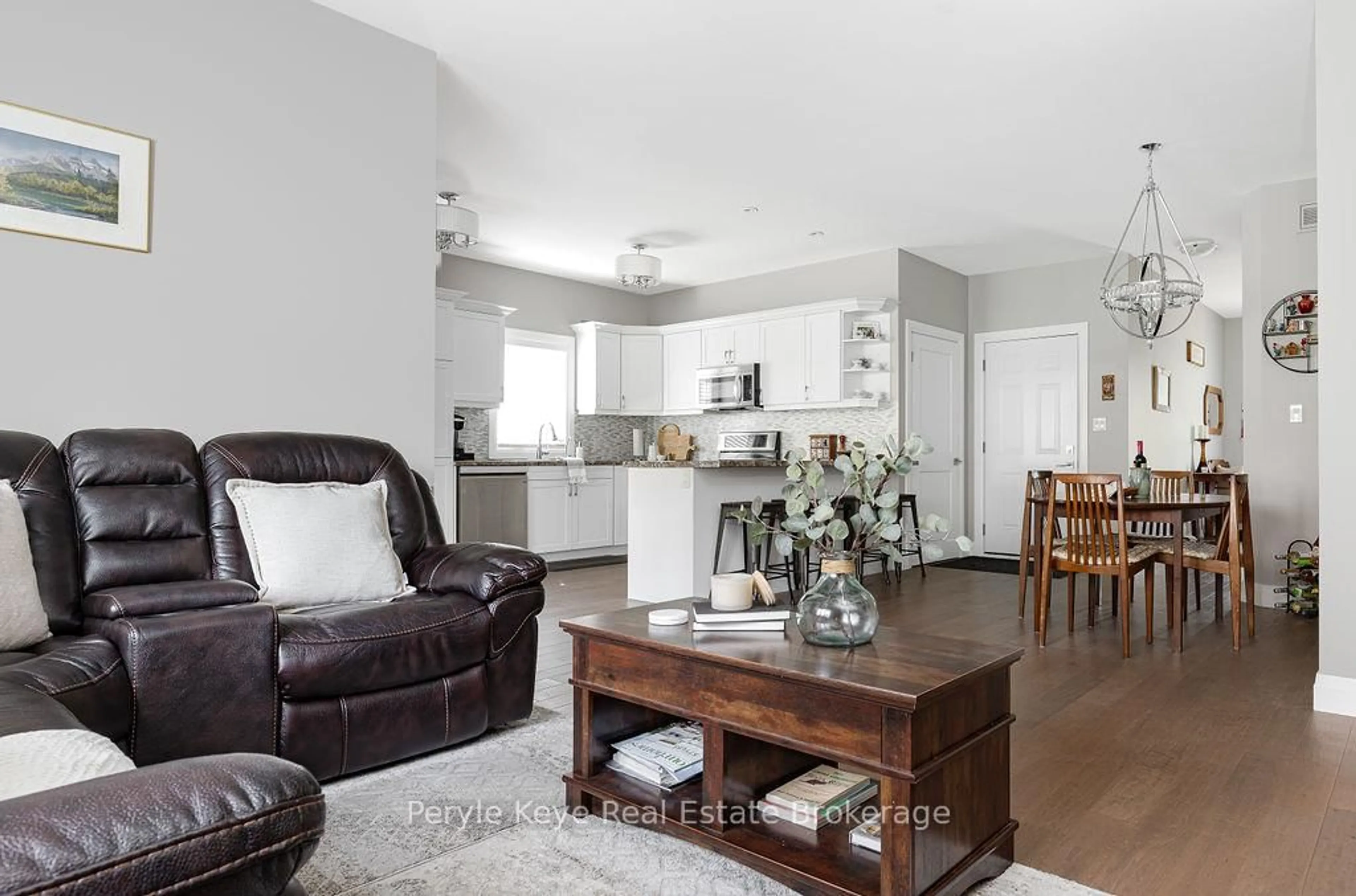 Living room with furniture, wood/laminate floor for 86 Chaffey Township Rd, Huntsville Ontario P1H 1C8