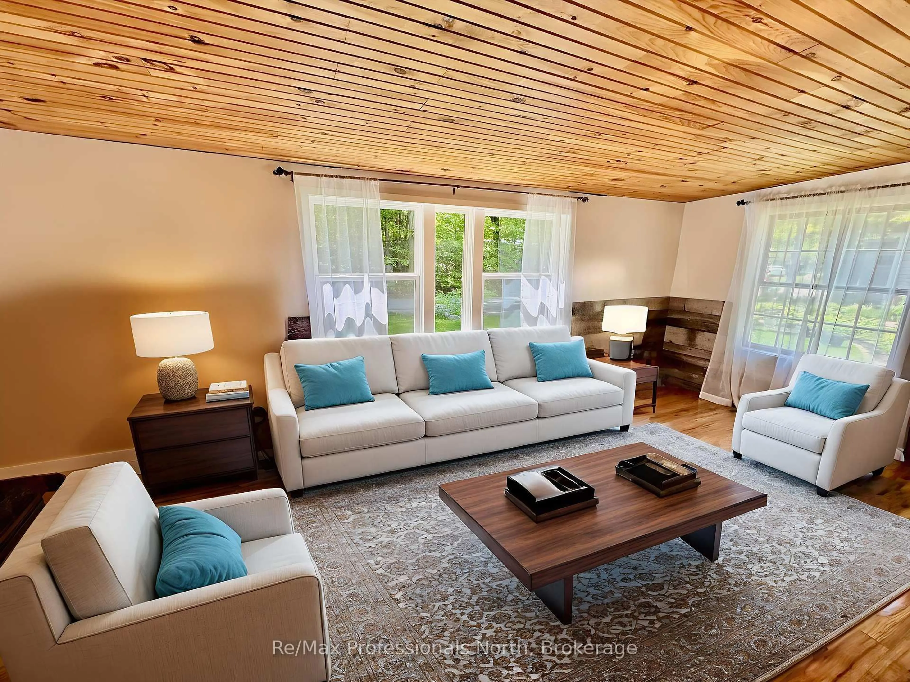 Living room with furniture, wood/laminate floor for 1007 Racoon Rd #86, Gravenhurst Ontario P1P 1R1