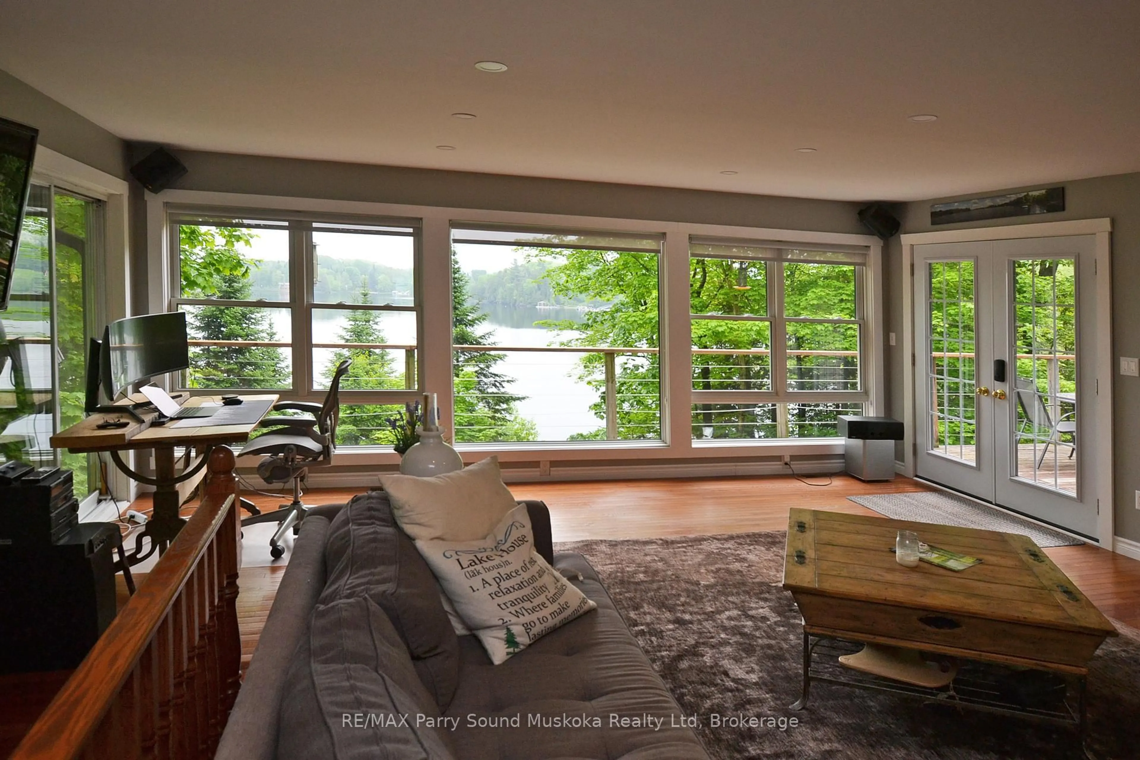 Living room with furniture, wood/laminate floor for 84 Captain Estates Rd, Whitestone Ontario P0A 1G0