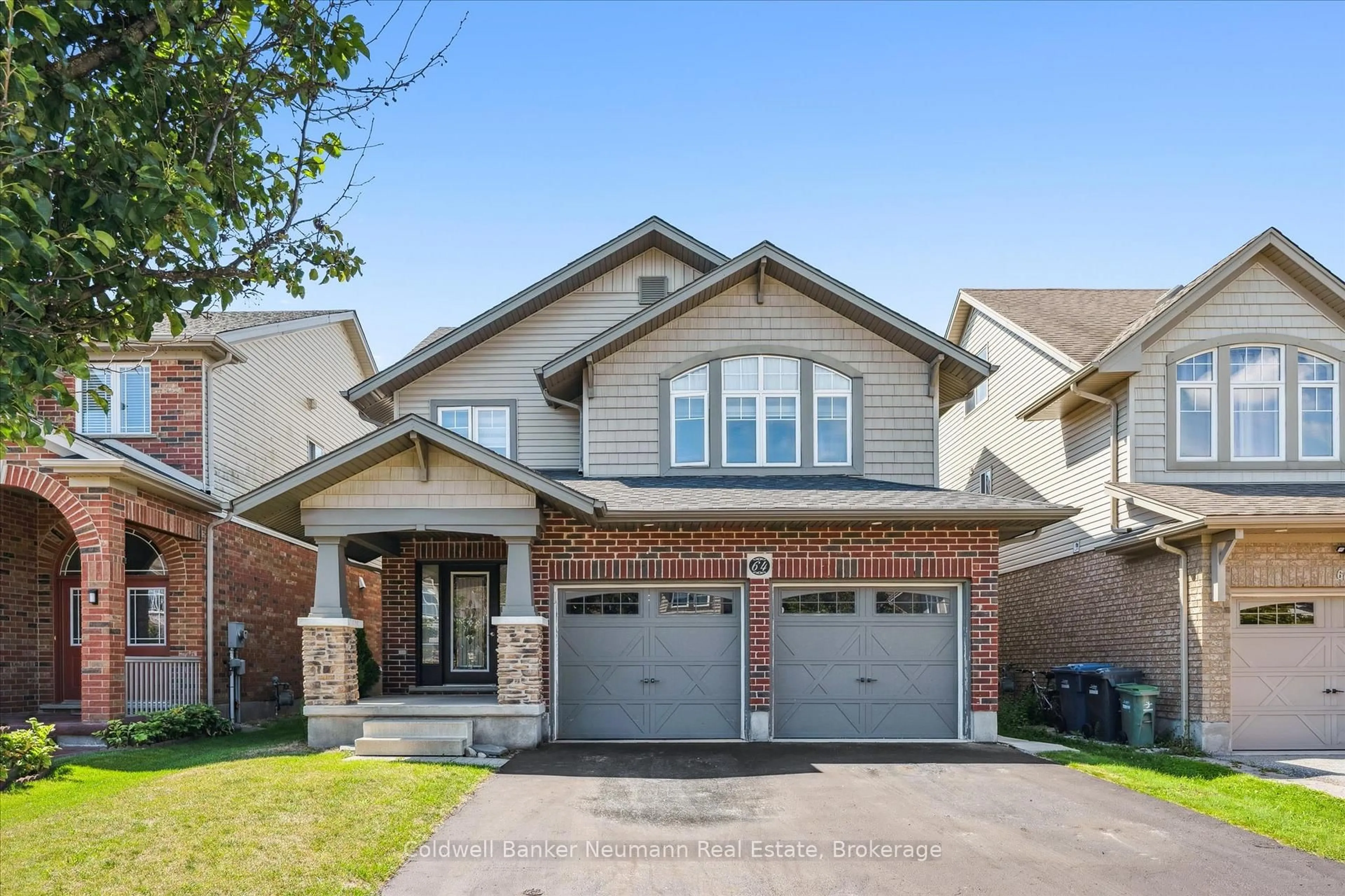 Home with brick exterior material, street for 64 Laughland Lane, Guelph Ontario N1L 0C6