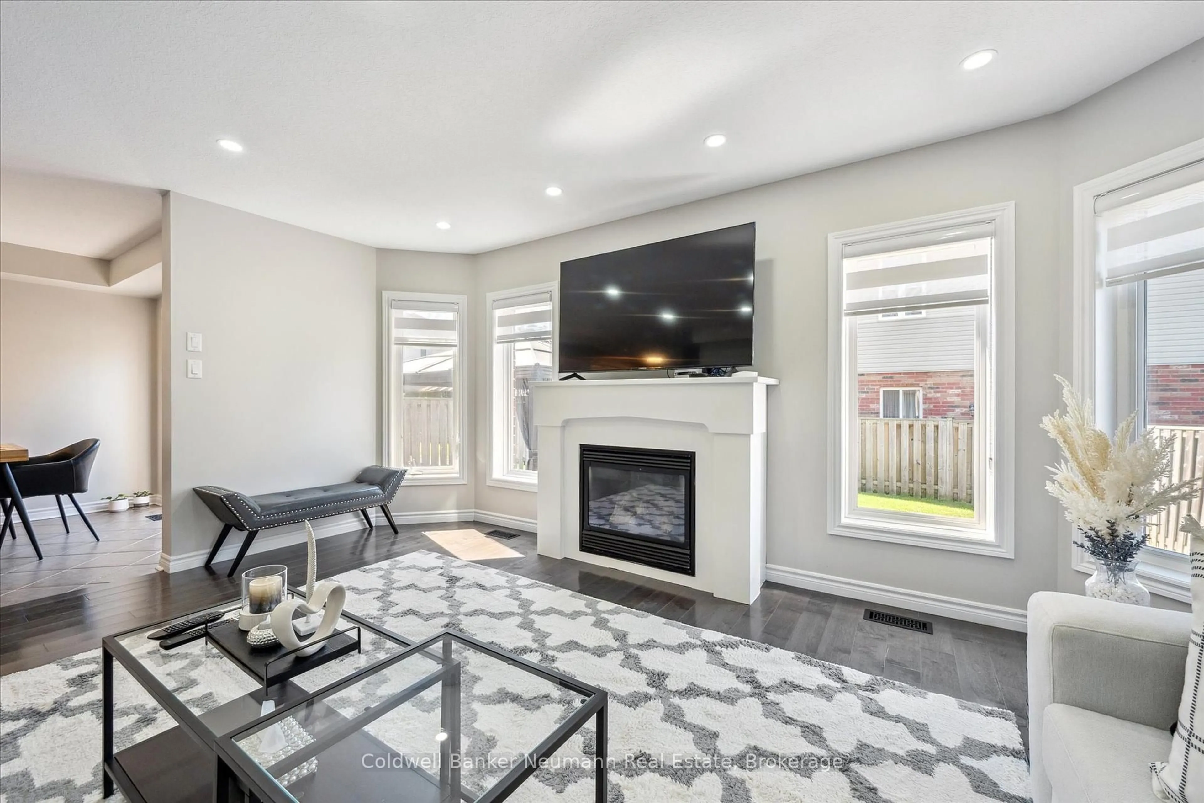 Living room with furniture, ceramic/tile floor for 64 Laughland Lane, Guelph Ontario N1L 0C6