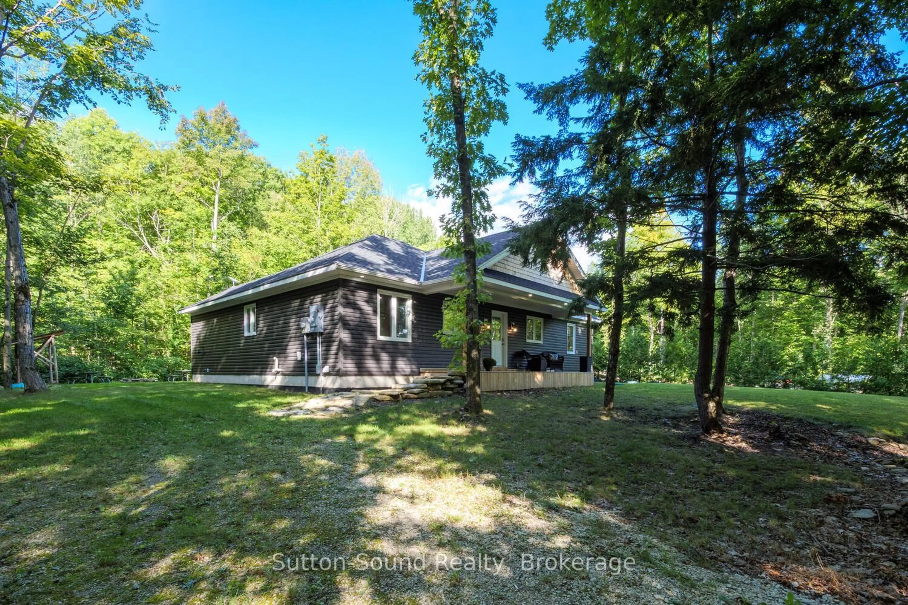 A pic from outside/outdoor area/front of a property/back of a property/a pic from drone, forest/trees view for 504760 Grey Road 1, Georgian Bluffs Ontario N0H 1S0