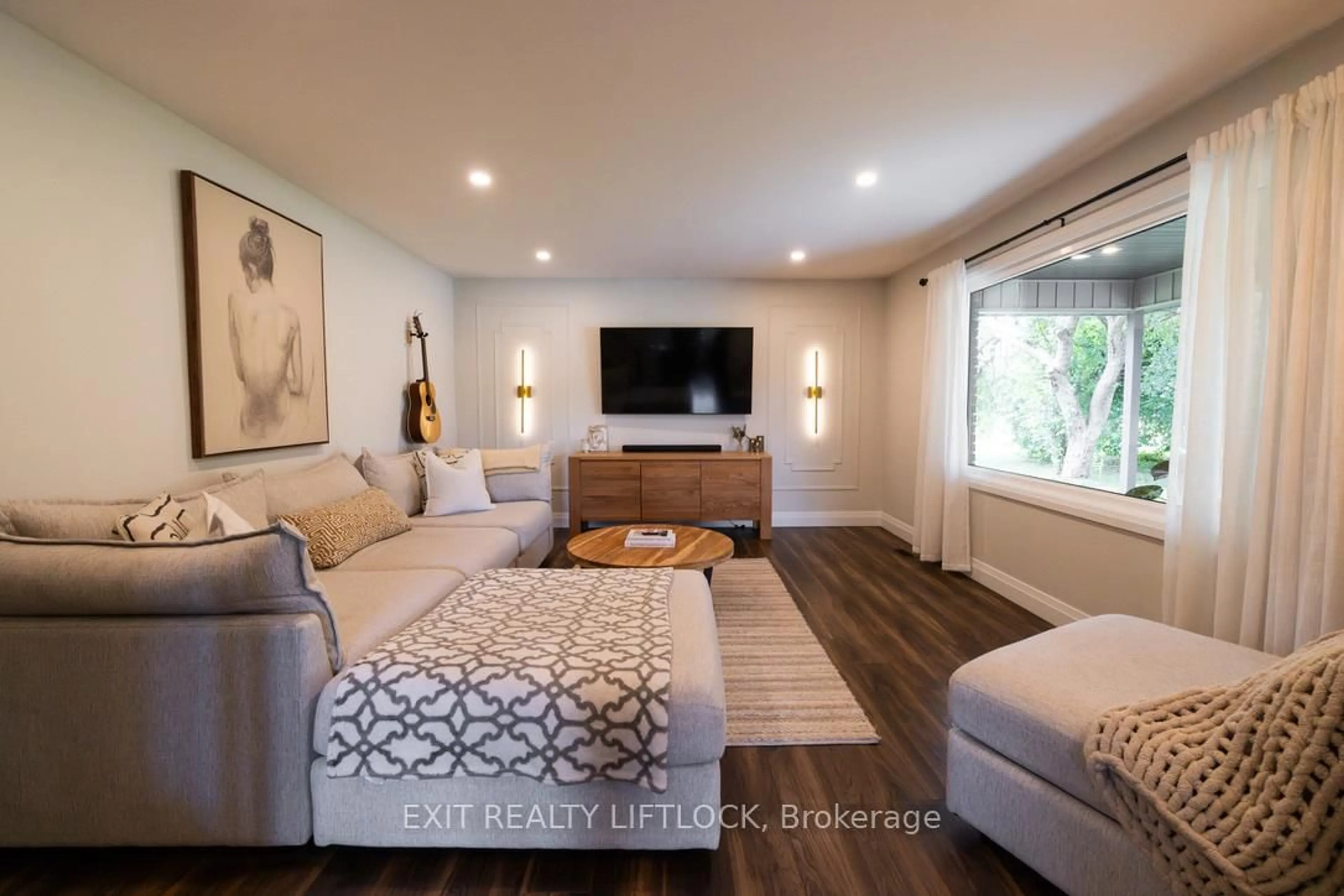 Living room with furniture, wood/laminate floor for 357 Simons Ave, Peterborough Ontario K9K 1E8