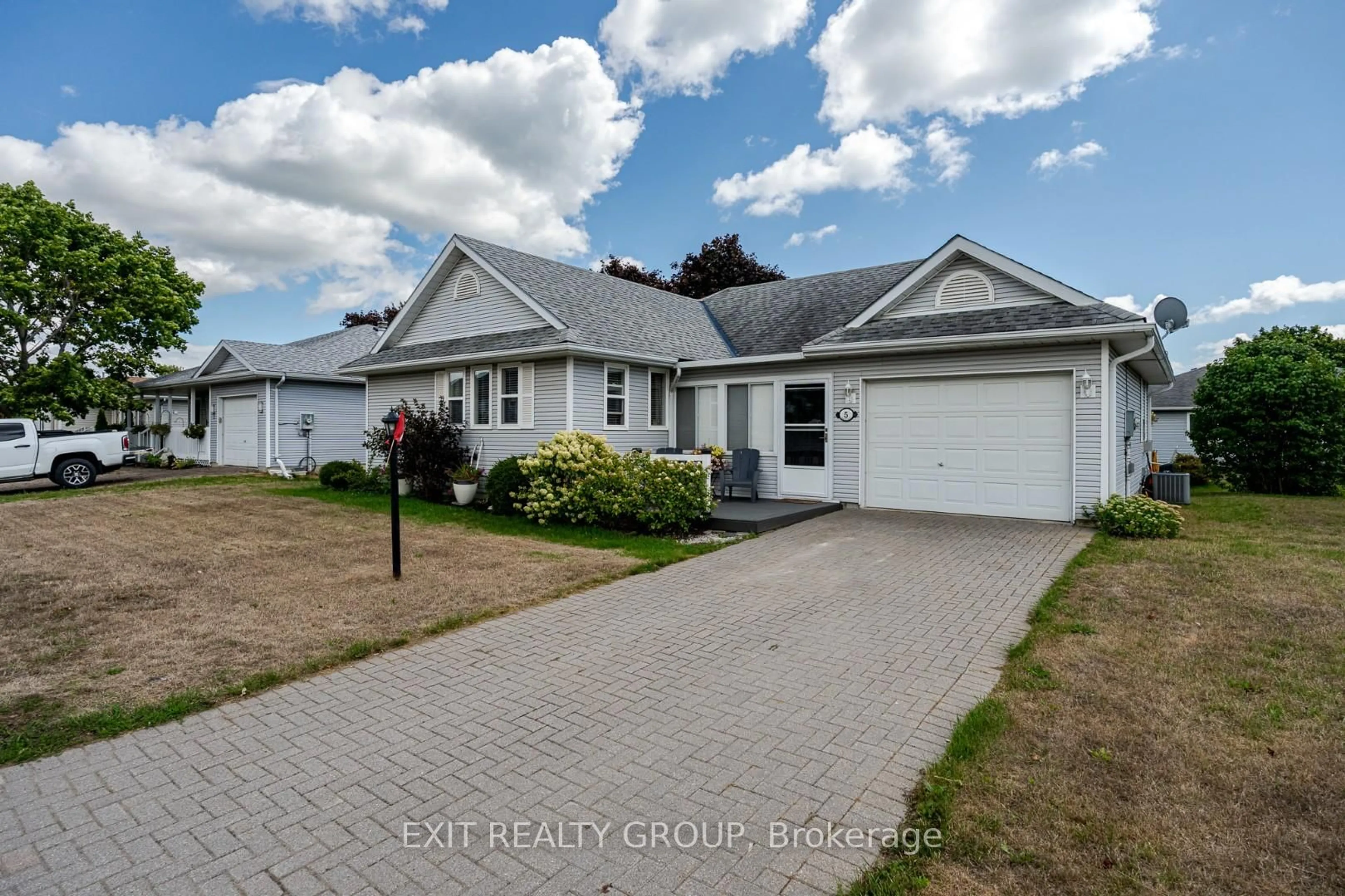 A pic from outside/outdoor area/front of a property/back of a property/a pic from drone, street for 5 Empire Blvd, Prince Edward County Ontario K0K 3L0