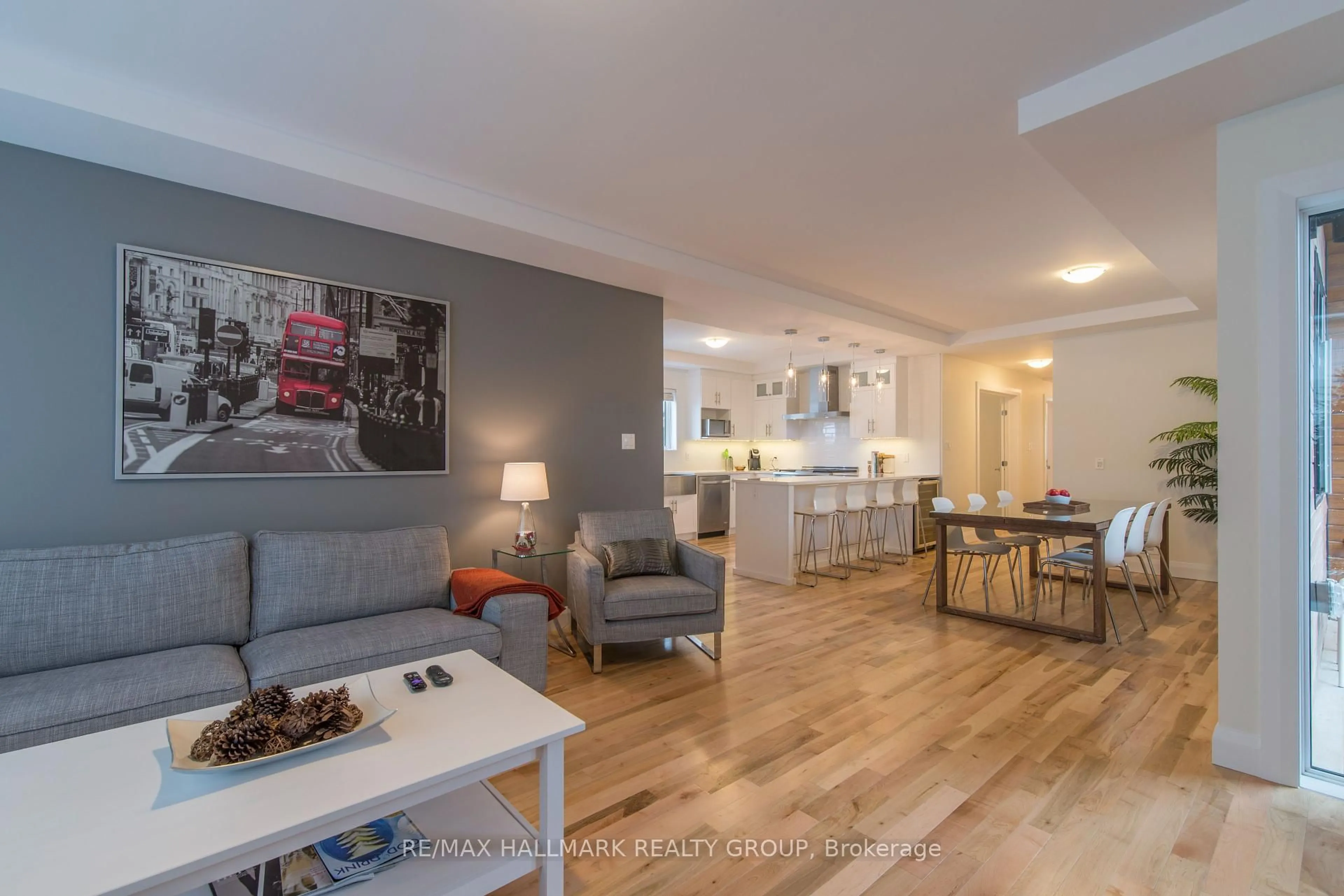 Living room with furniture, wood/laminate floor for 59 Douglas Ave, Ottawa Ontario K1M 1G3