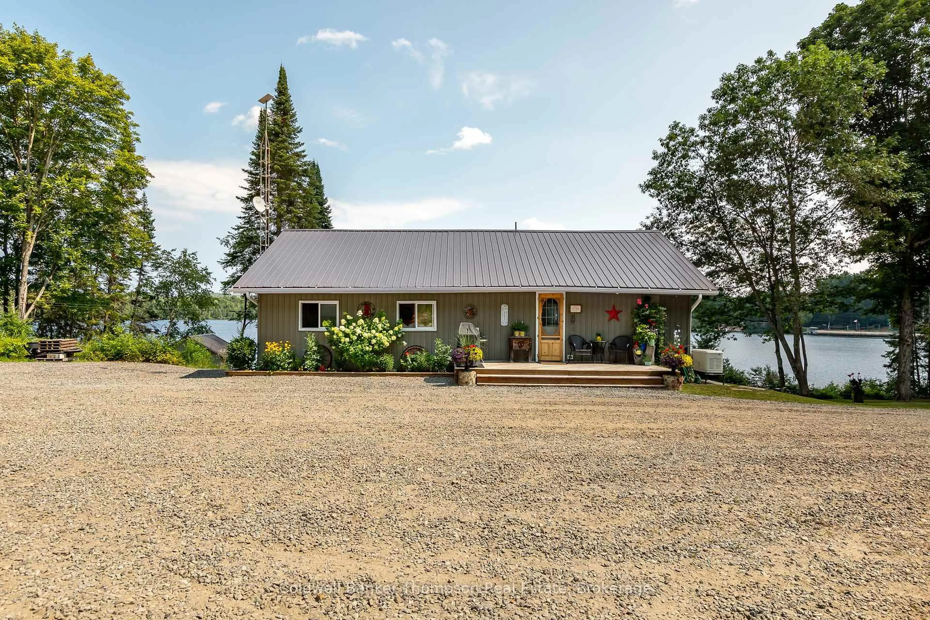A pic from outside/outdoor area/front of a property/back of a property/a pic from drone, water/lake/river/ocean view for 85 Nulty Lane, Armour Ontario P0A 1J0