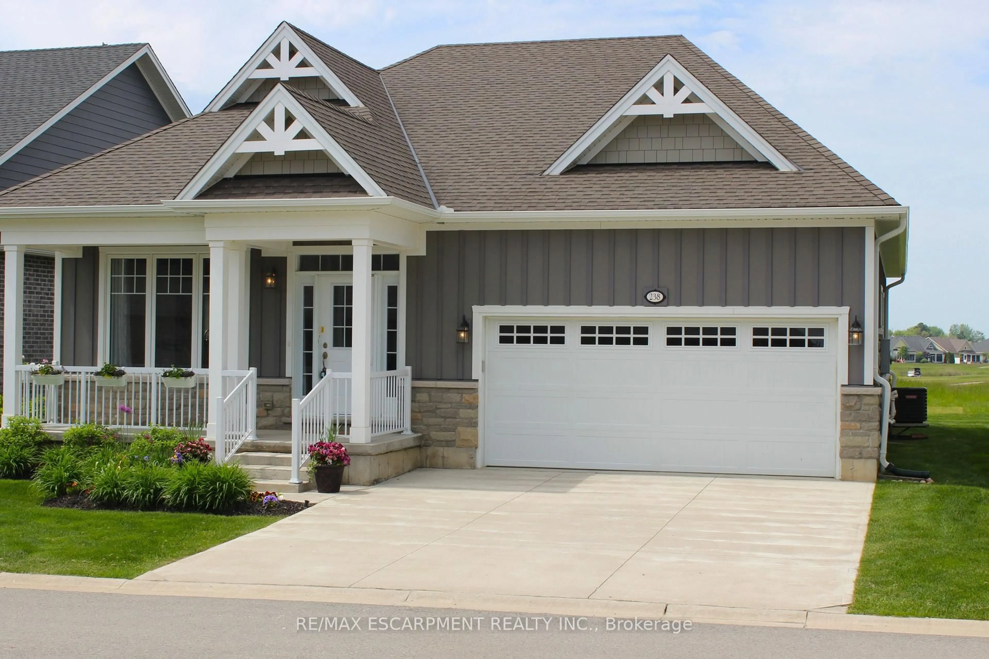 Home with vinyl exterior material, street for 238 Schooner Dr, Norfolk Ontario N0A 1N3