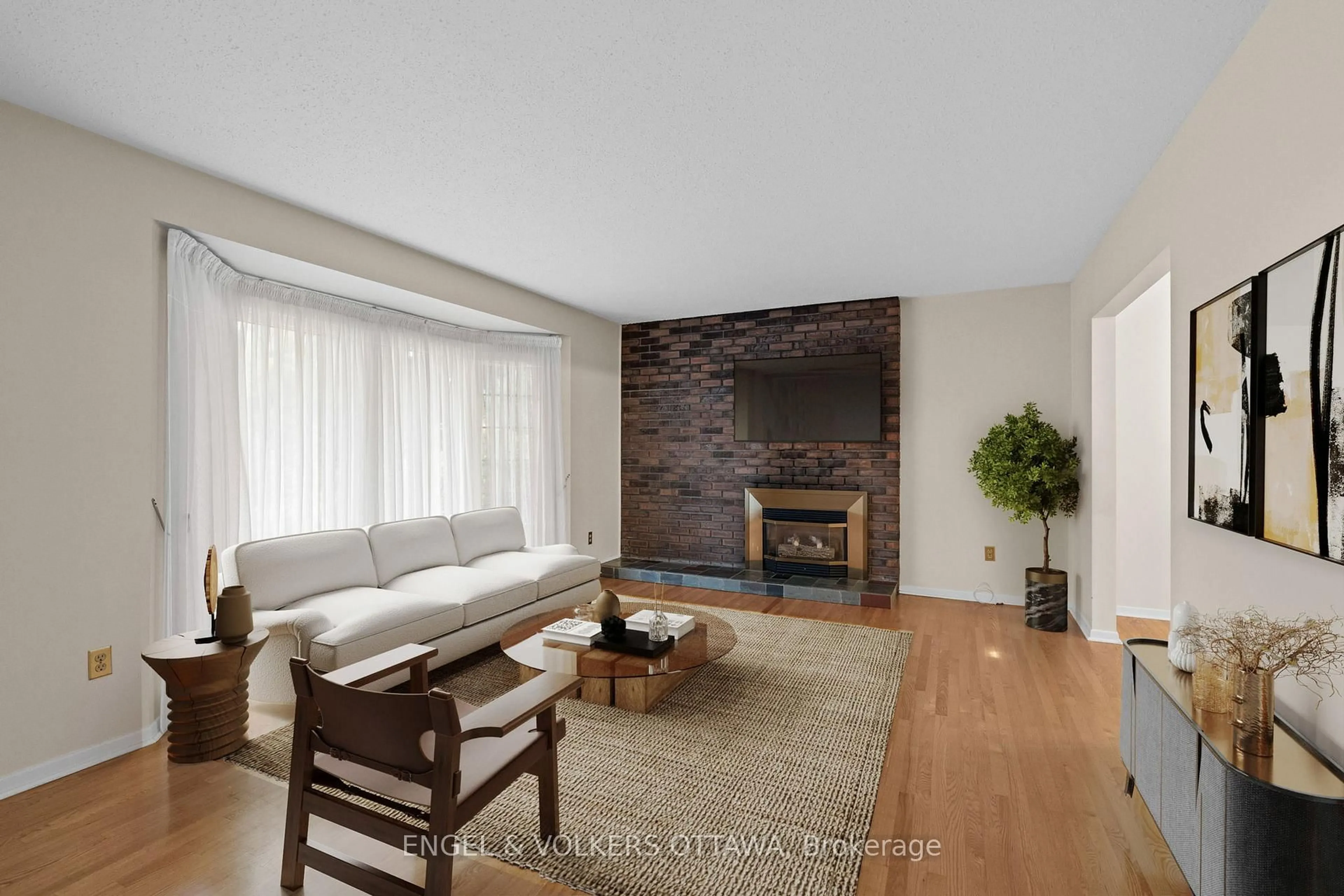 Living room with furniture, wood/laminate floor for 3348 Kodiak St, Ottawa Ontario K1V 7S8