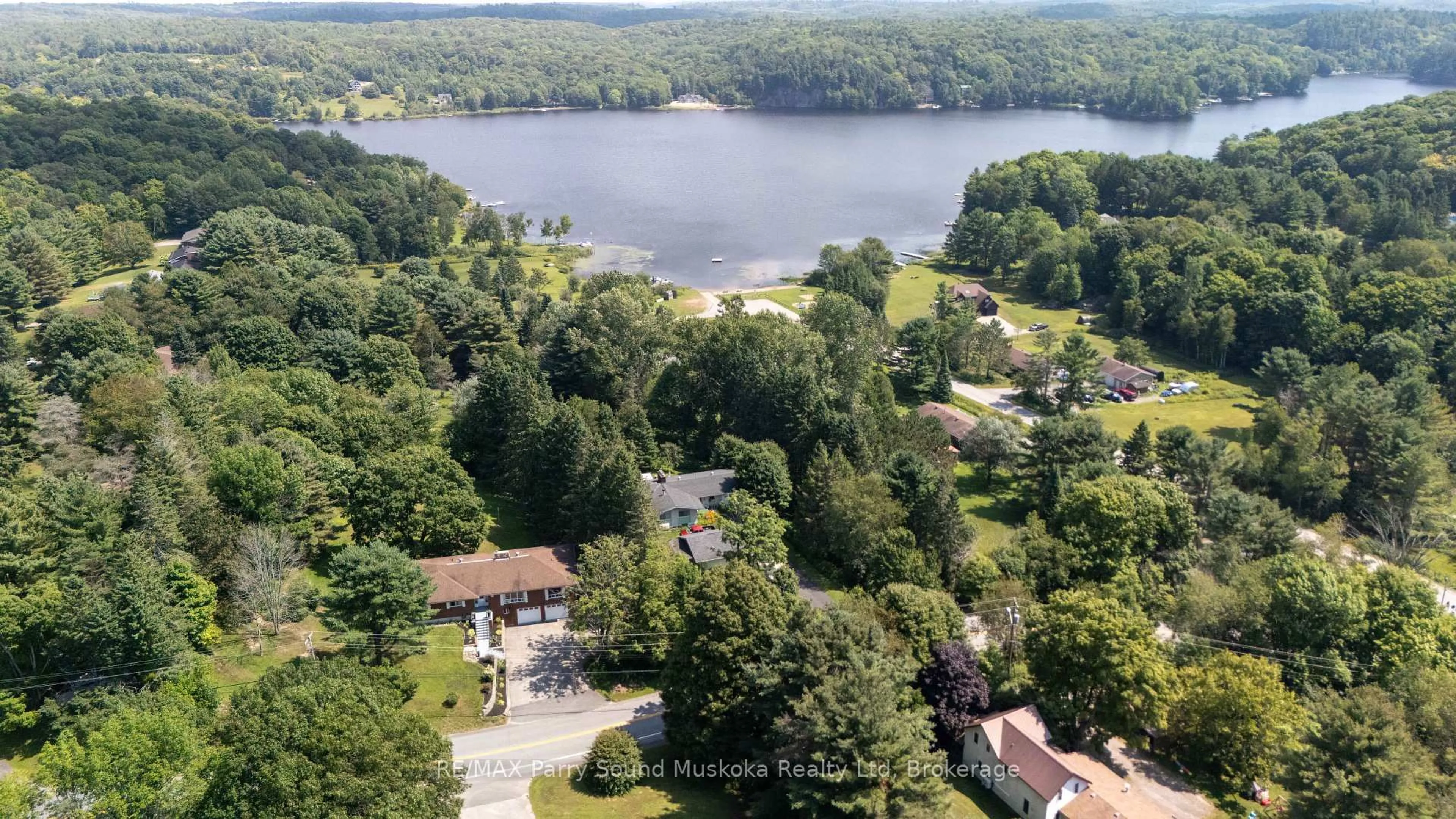 A pic from outside/outdoor area/front of a property/back of a property/a pic from drone, water/lake/river/ocean view for 113 North Rd, McDougall Ontario P2A 2W9