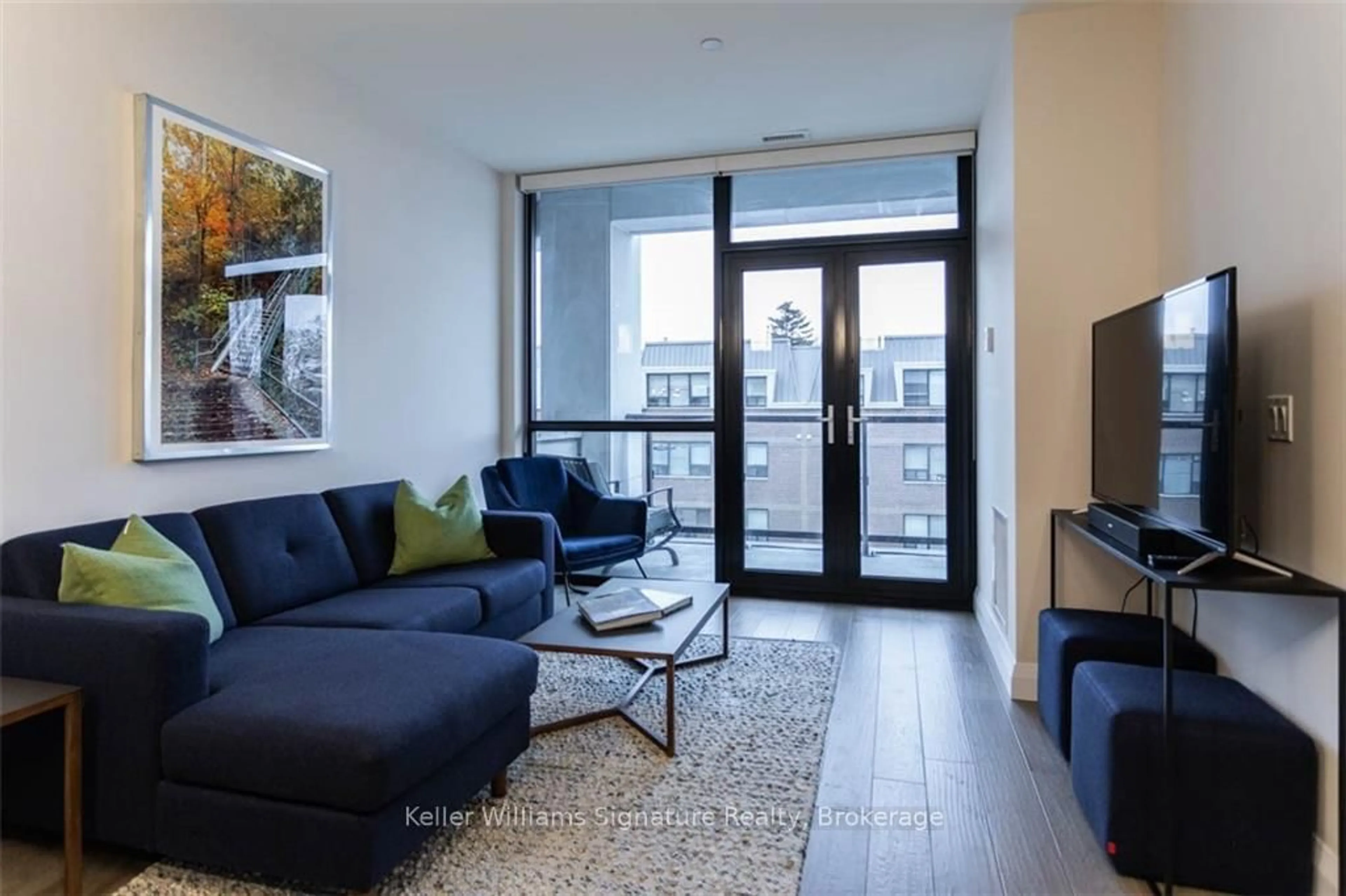 Living room with furniture, wood/laminate floor for 101 Locke St #207, Hamilton Ontario L8P 4A6