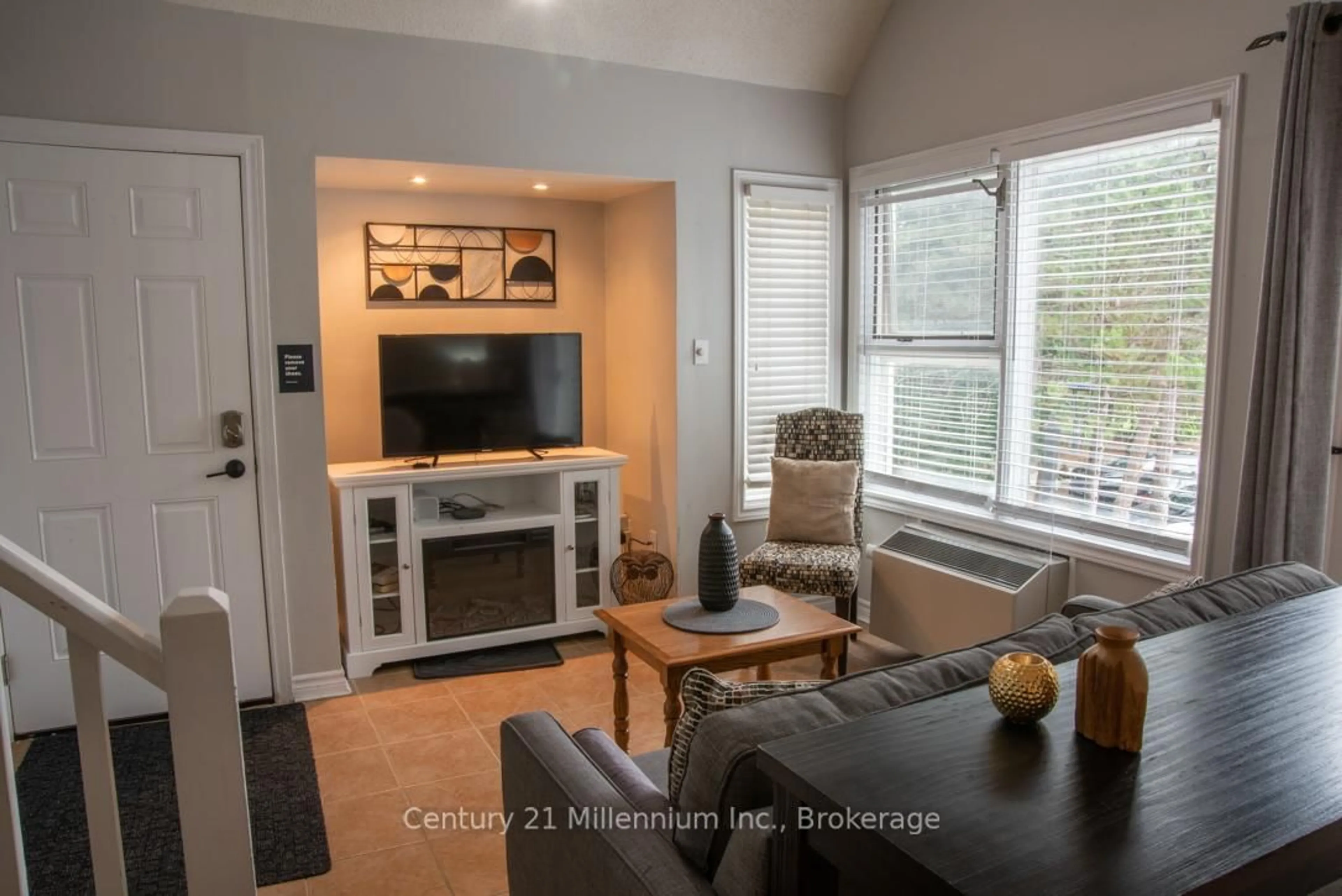 Living room with furniture, wood/laminate floor for 796468 Grey 19 Rd #110, Blue Mountains Ontario L9Y 0N6