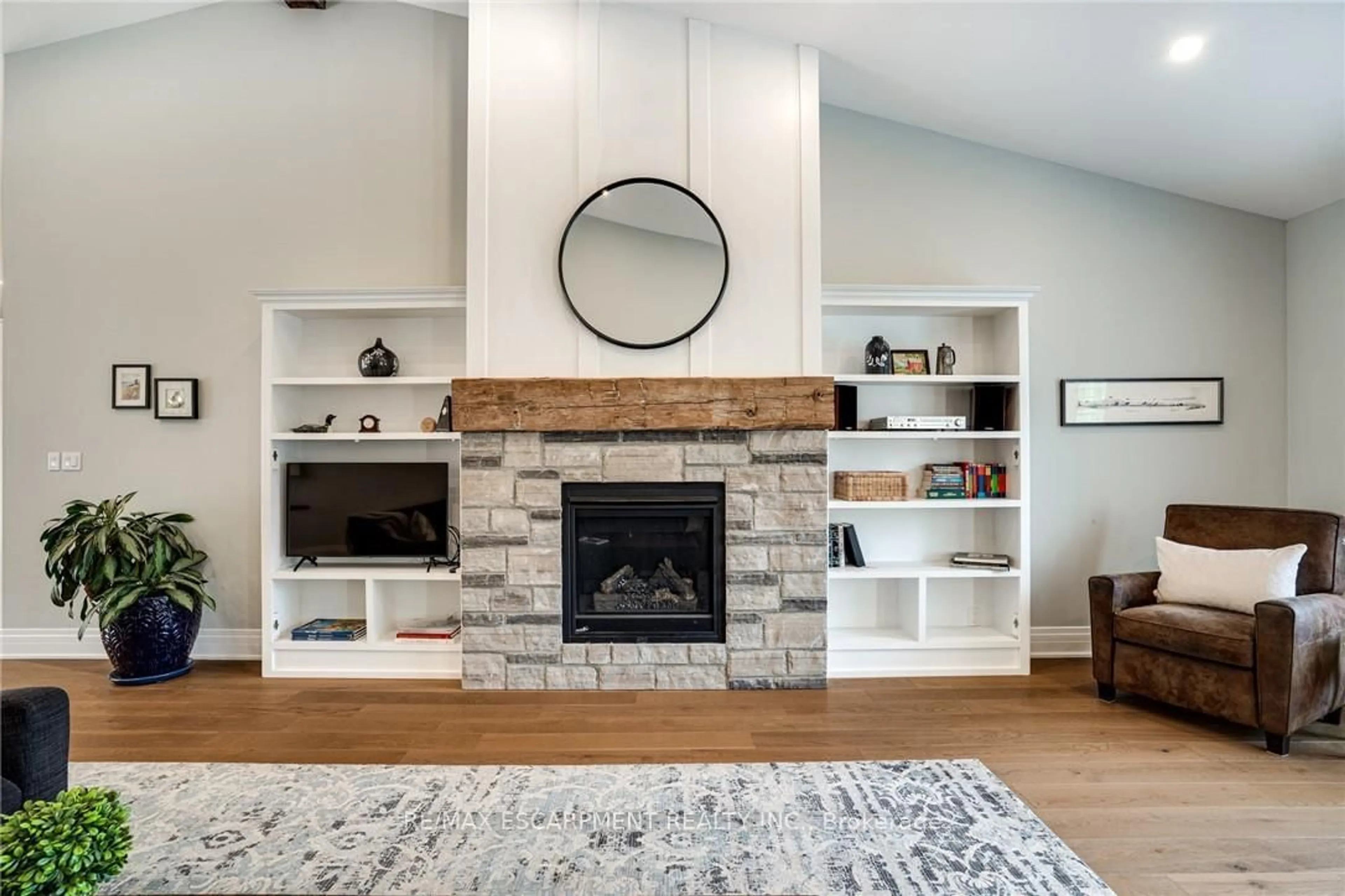 Living room with furniture, wood/laminate floor for 14 Sullivan's Lane, Hamilton Ontario L9H 5N7