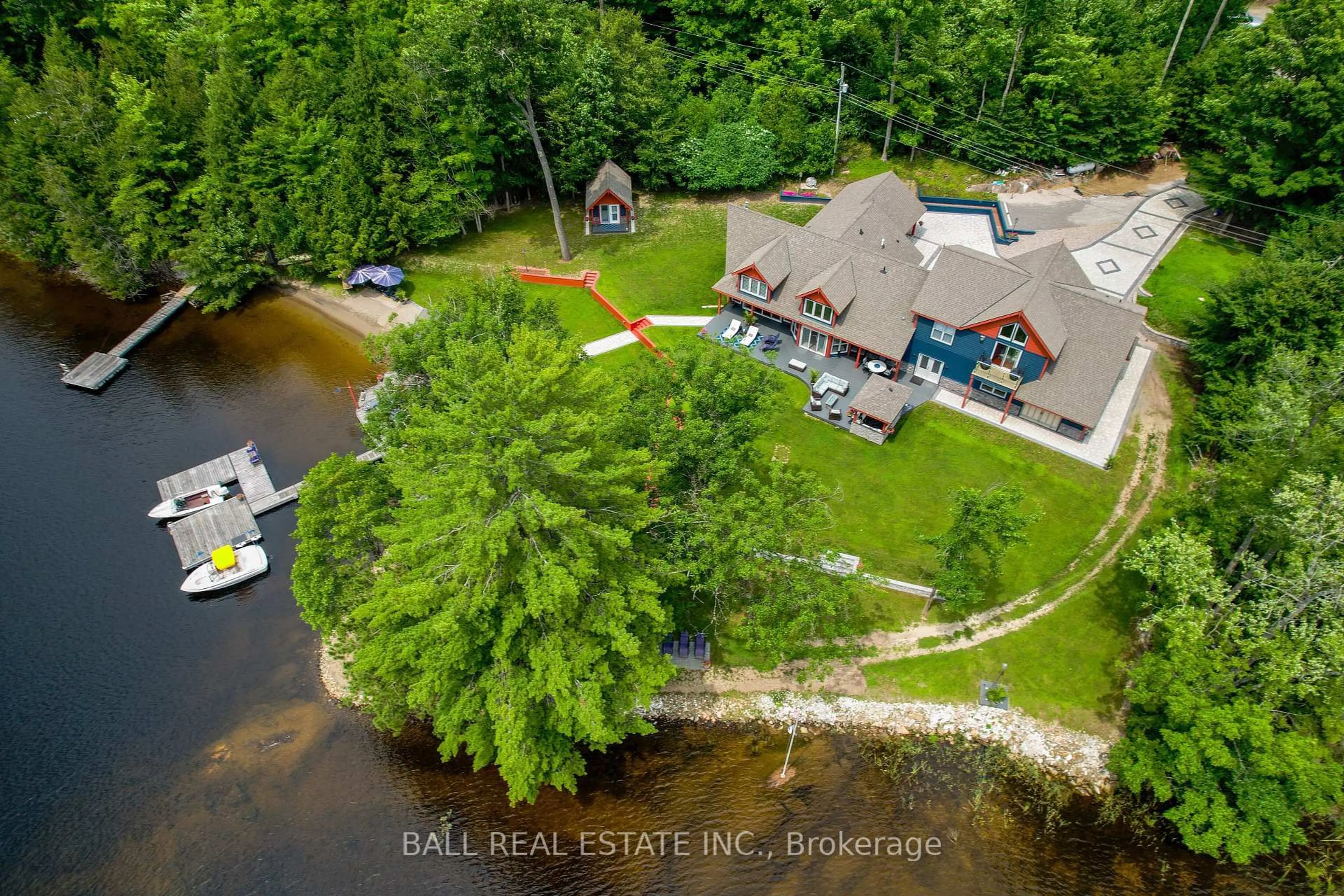 A pic from outside/outdoor area/front of a property/back of a property/a pic from drone, water/lake/river/ocean view for 33 Fire Route 210, Trent Lakes Ontario K0L 1J0