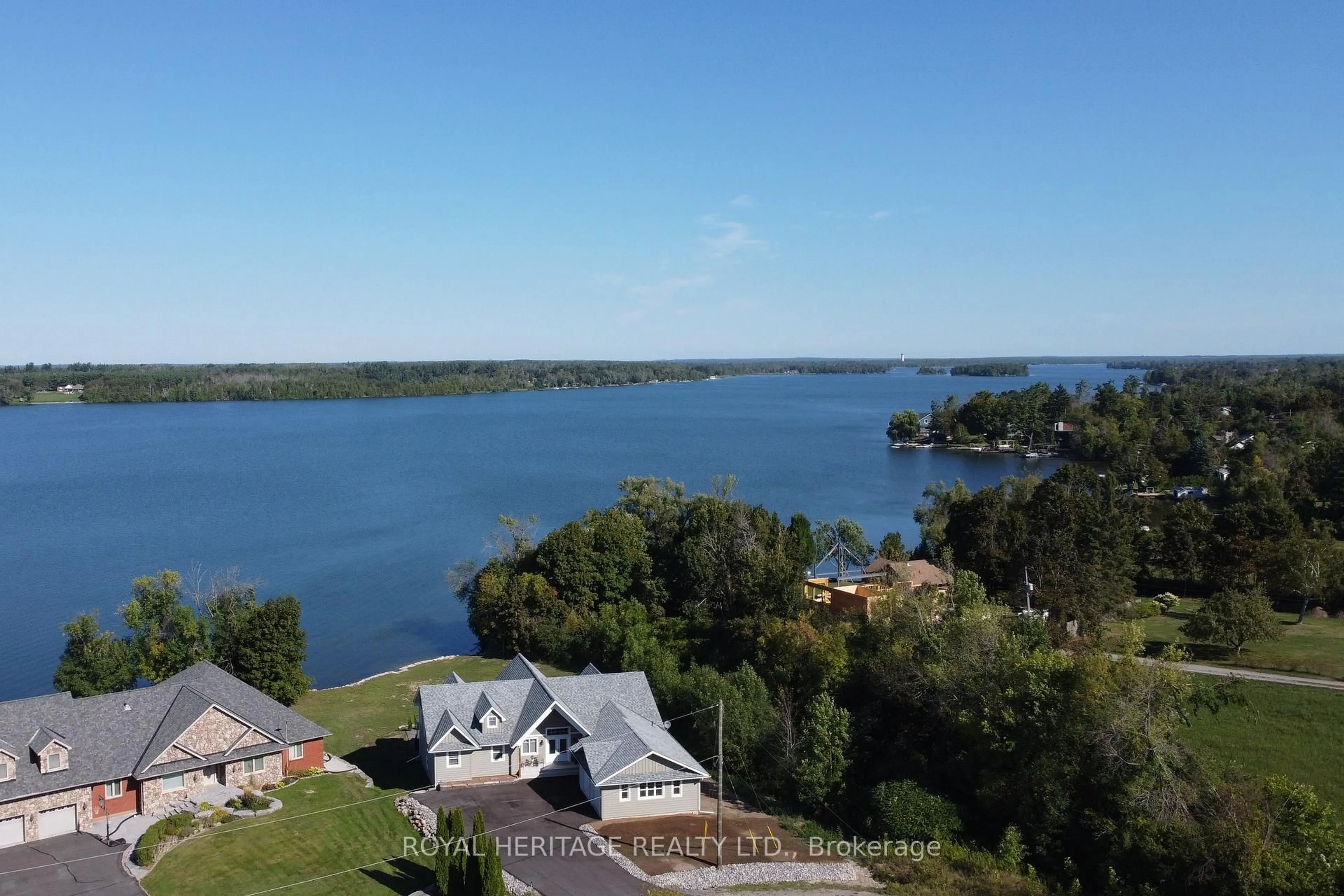 A pic from outside/outdoor area/front of a property/back of a property/a pic from drone, water/lake/river/ocean view for 1470 Pebble Beach Rd, Selwyn Ontario K9J 6X5