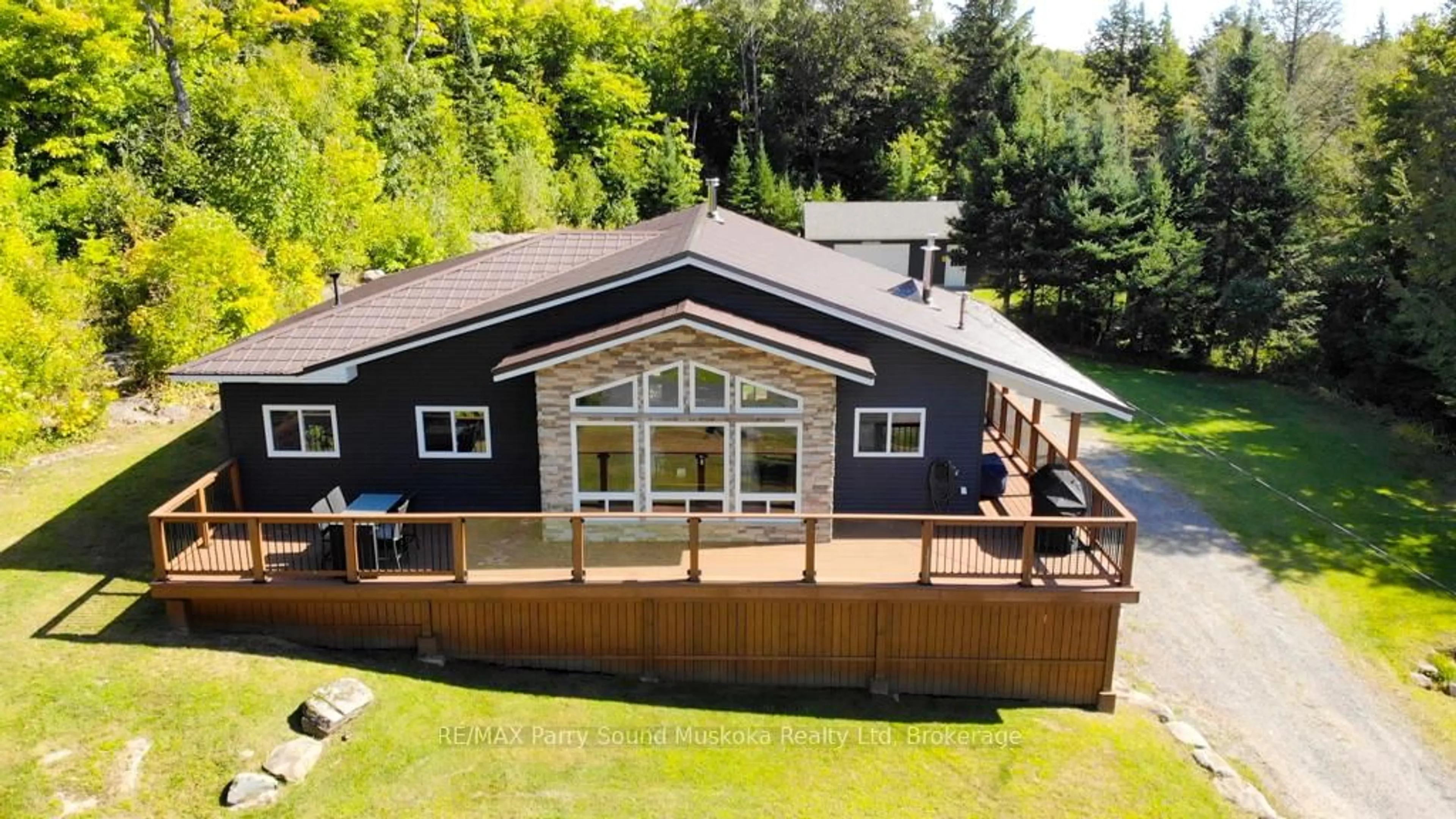 A pic from outside/outdoor area/front of a property/back of a property/a pic from drone, unknown for 127 BURNETTS Rd, McKellar Ontario P2A 0B5