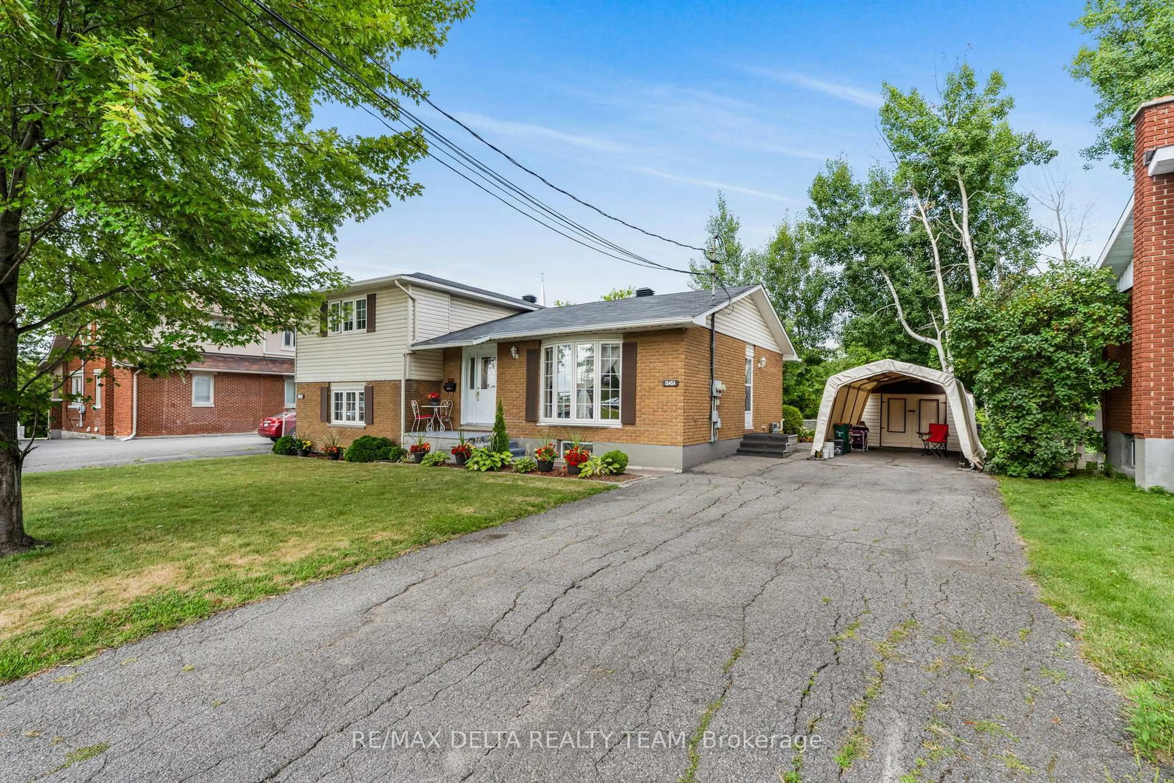 Home with brick exterior material, street for 1345 BELCOURT Blvd, Ottawa Ontario K1C 1L8