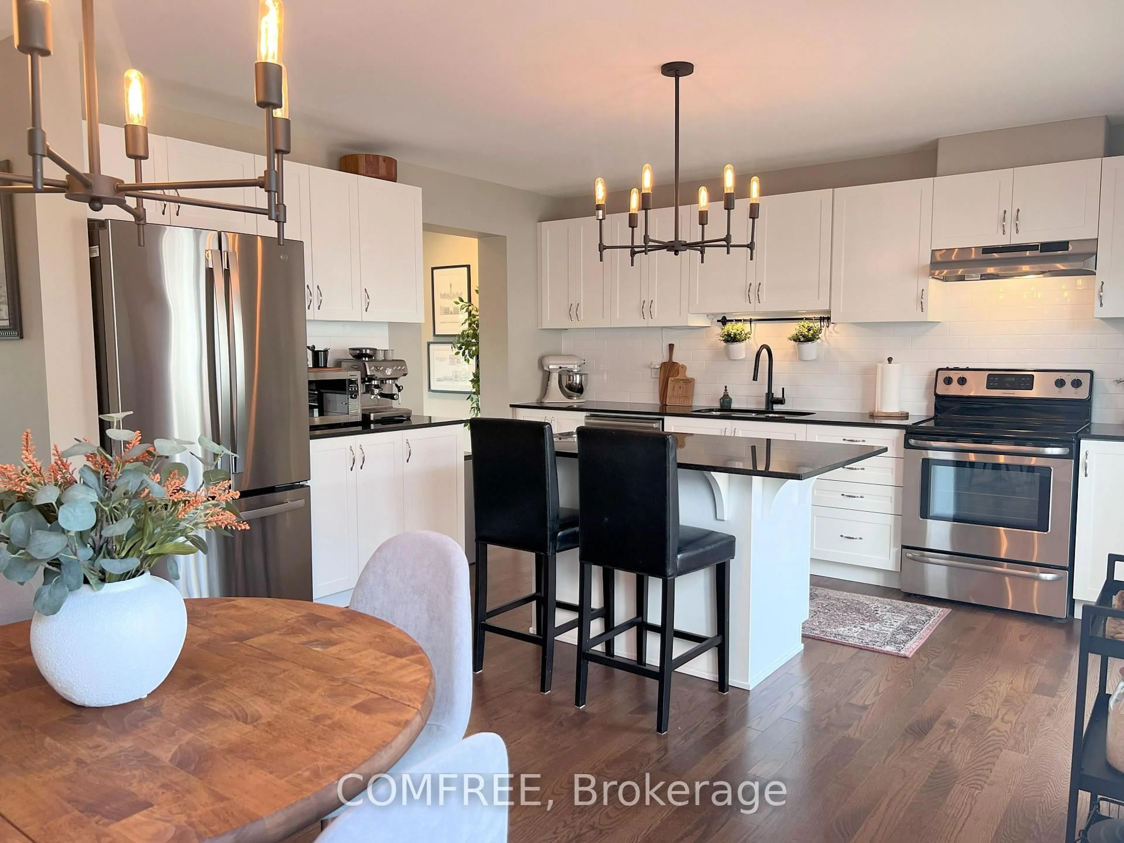 Open concept kitchen, wood/laminate floor for 84 Brisote Lane, Stittsville Ontario K2S 0V3