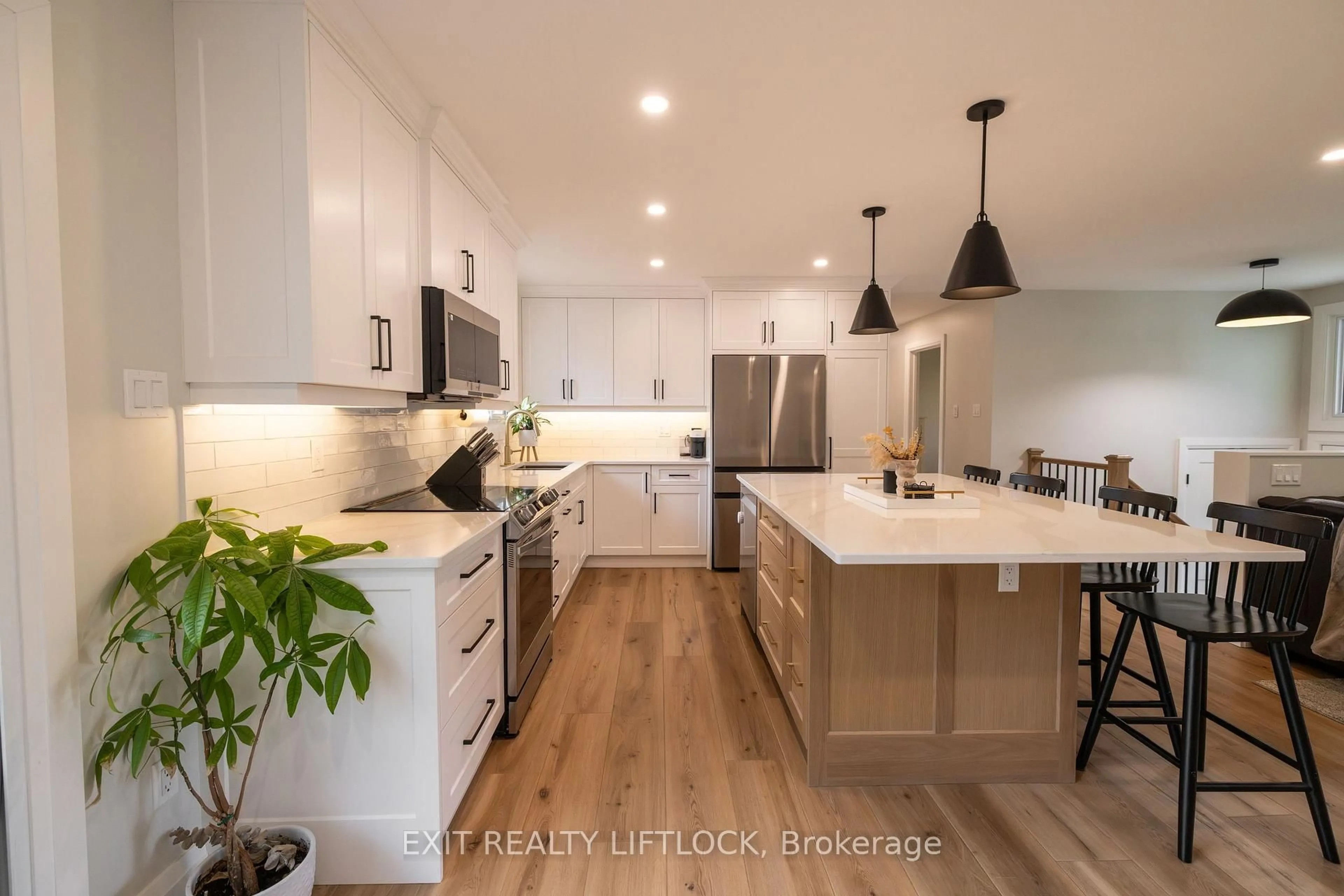 Open concept kitchen, wood/laminate floor for 47 Emily Manor Dr, Kawartha Lakes Ontario K0L 2W0