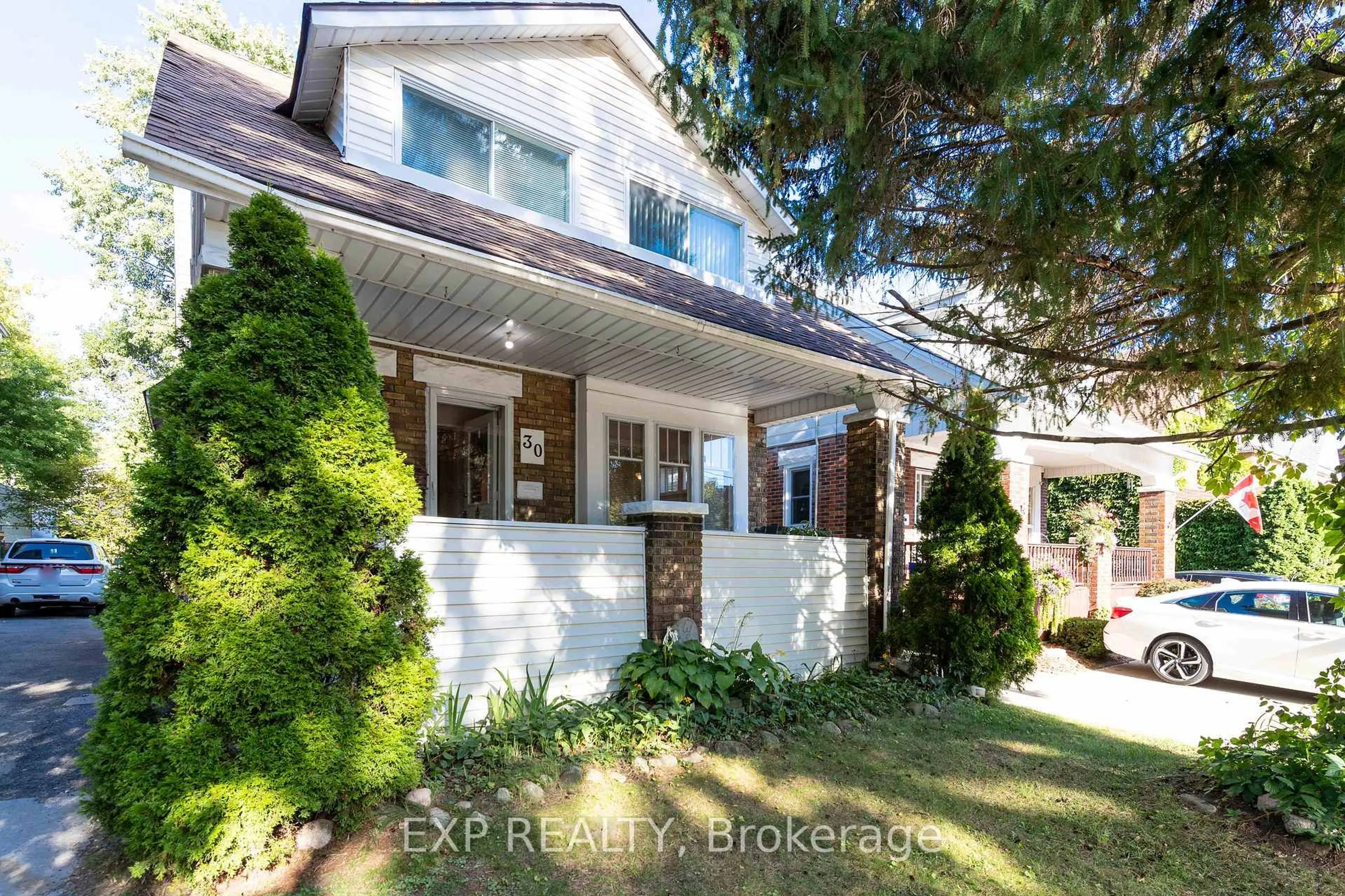 Home with brick exterior material, street for 30 Troy St, Kitchener Ontario N2H 1L8