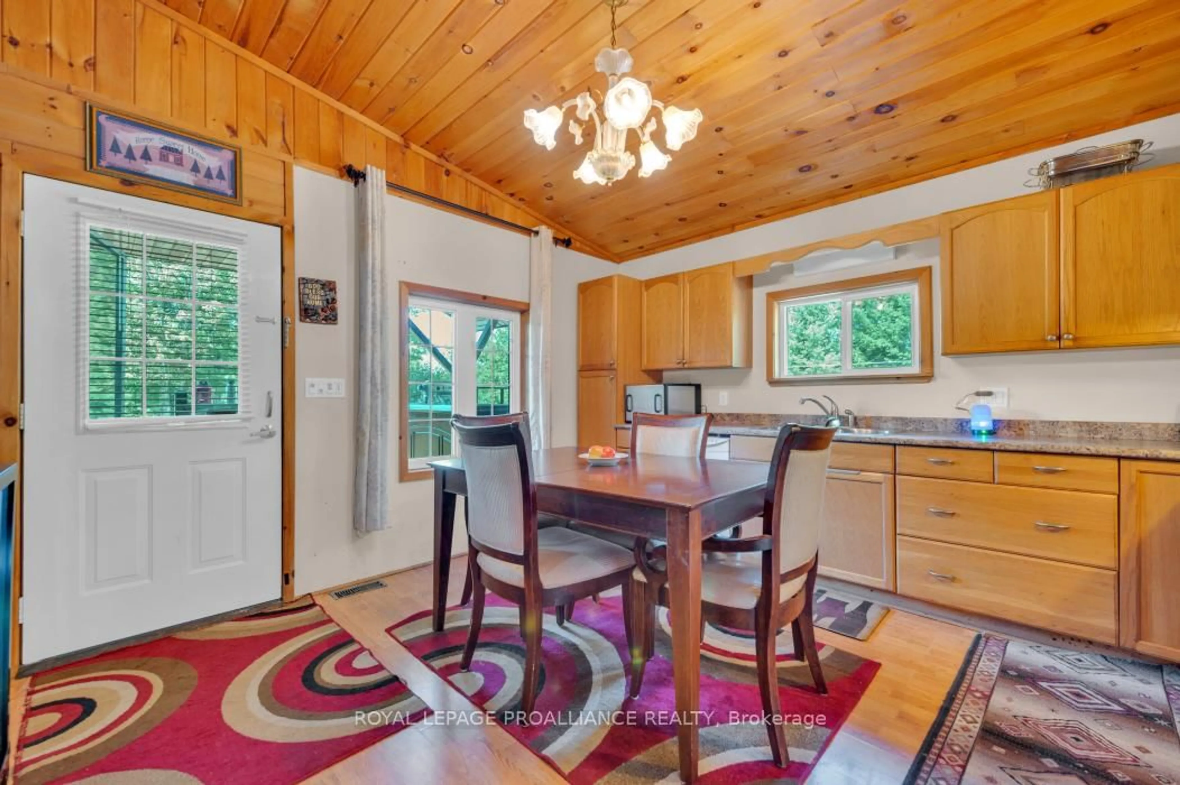 Open concept kitchen, wood/laminate floor for 11447 Highway 41, Kaladar Ontario K0H 1Z0
