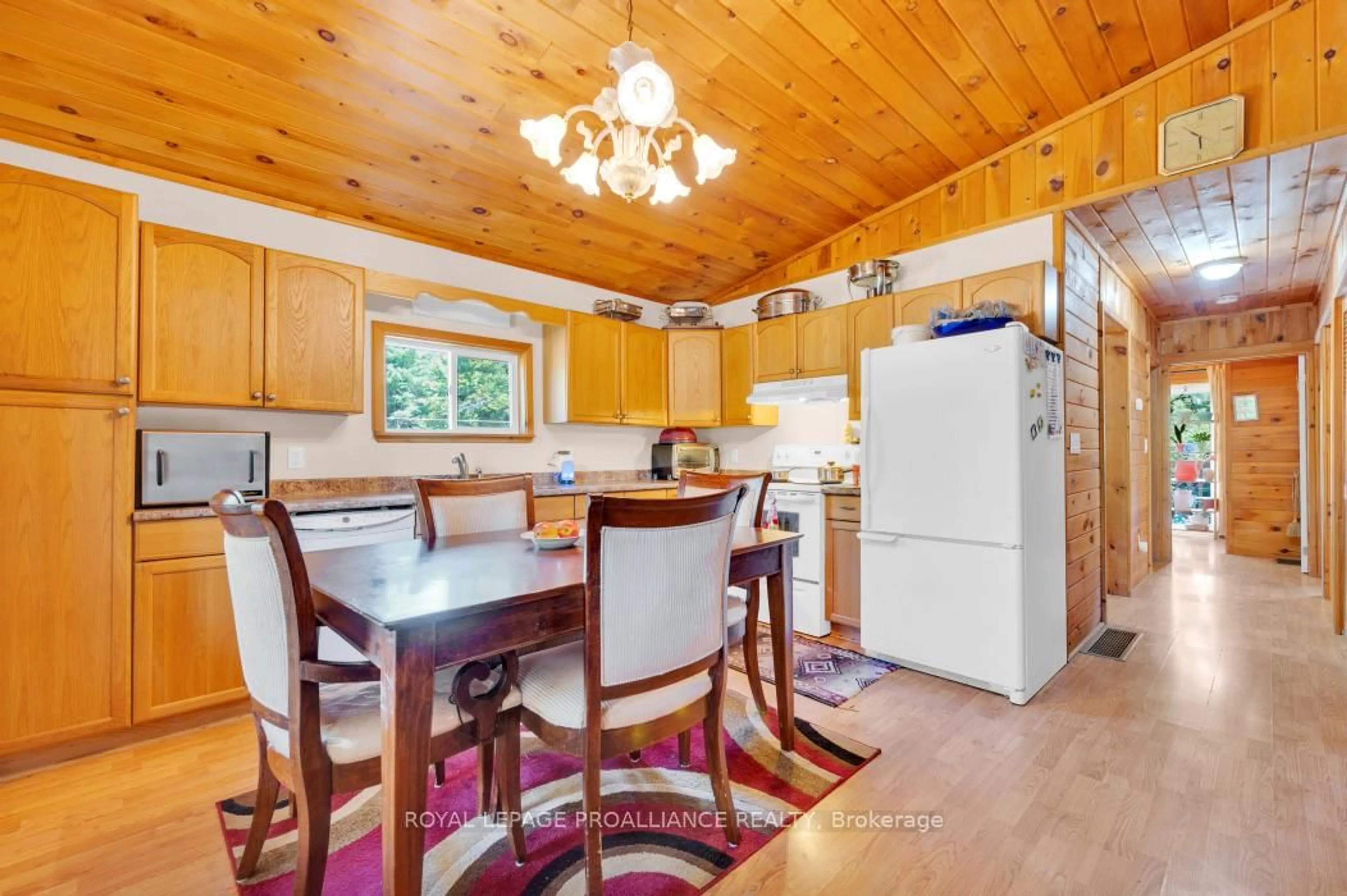 Open concept kitchen, wood/laminate floor for 11447 Highway 41, Kaladar Ontario K0H 1Z0
