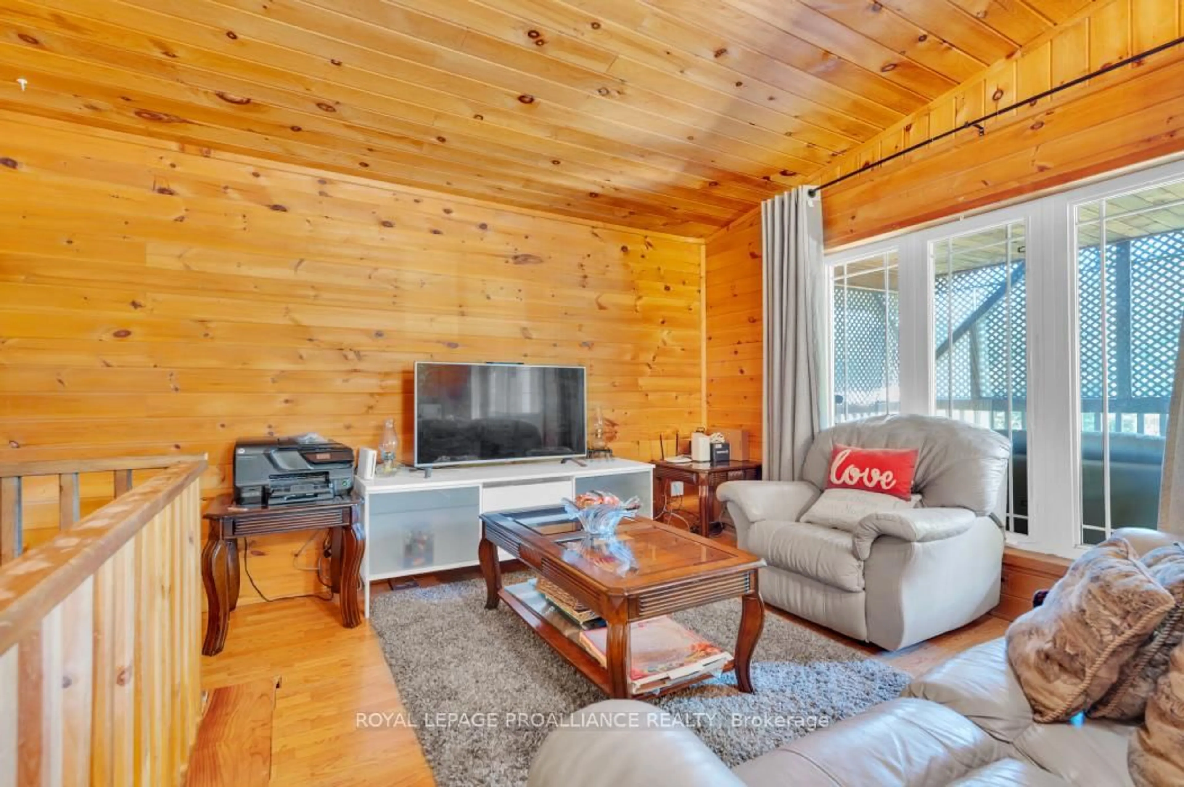 Living room with furniture, wood/laminate floor for 11447 Highway 41, Kaladar Ontario K0H 1Z0