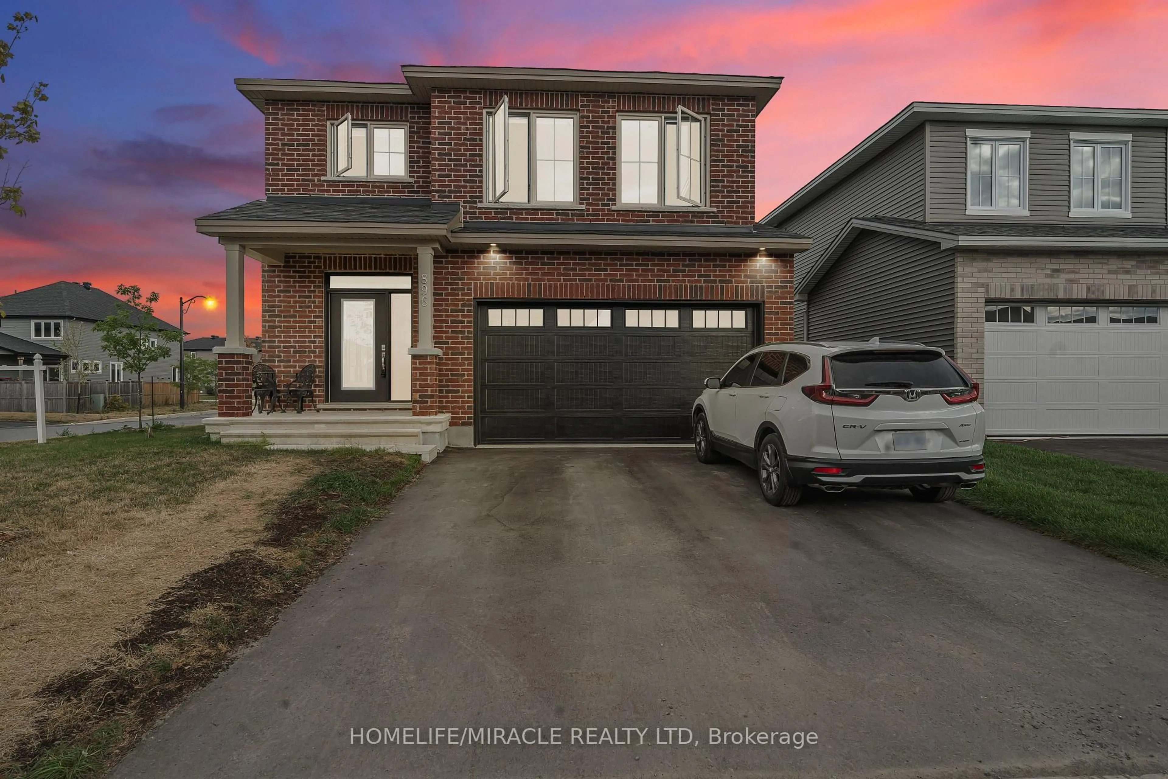 Home with brick exterior material, street for 896 Sendero Way, Stittsville Ontario K2S 2W8