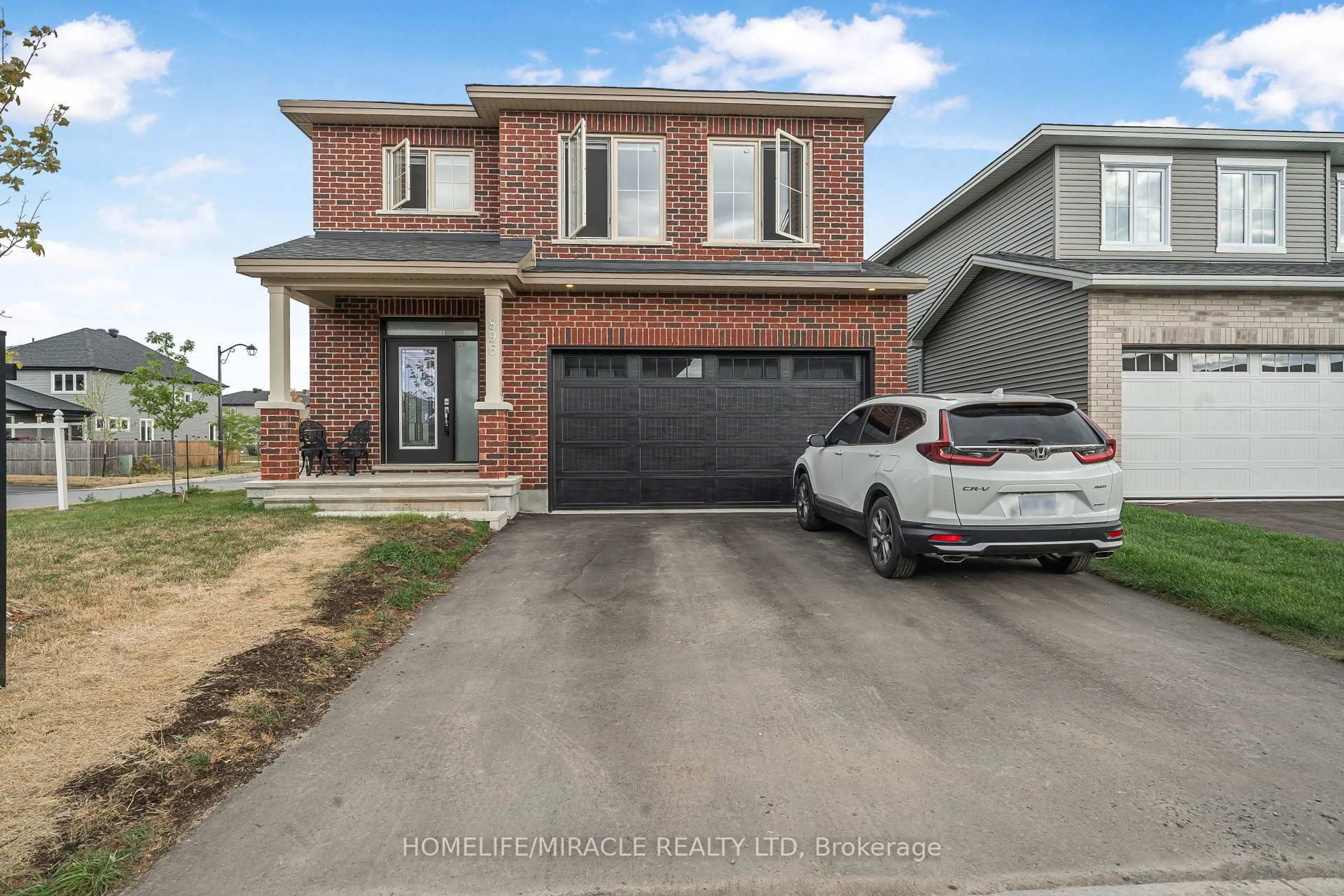 Home with brick exterior material, street for 896 Sendero Way, Stittsville Ontario K2S 2W8