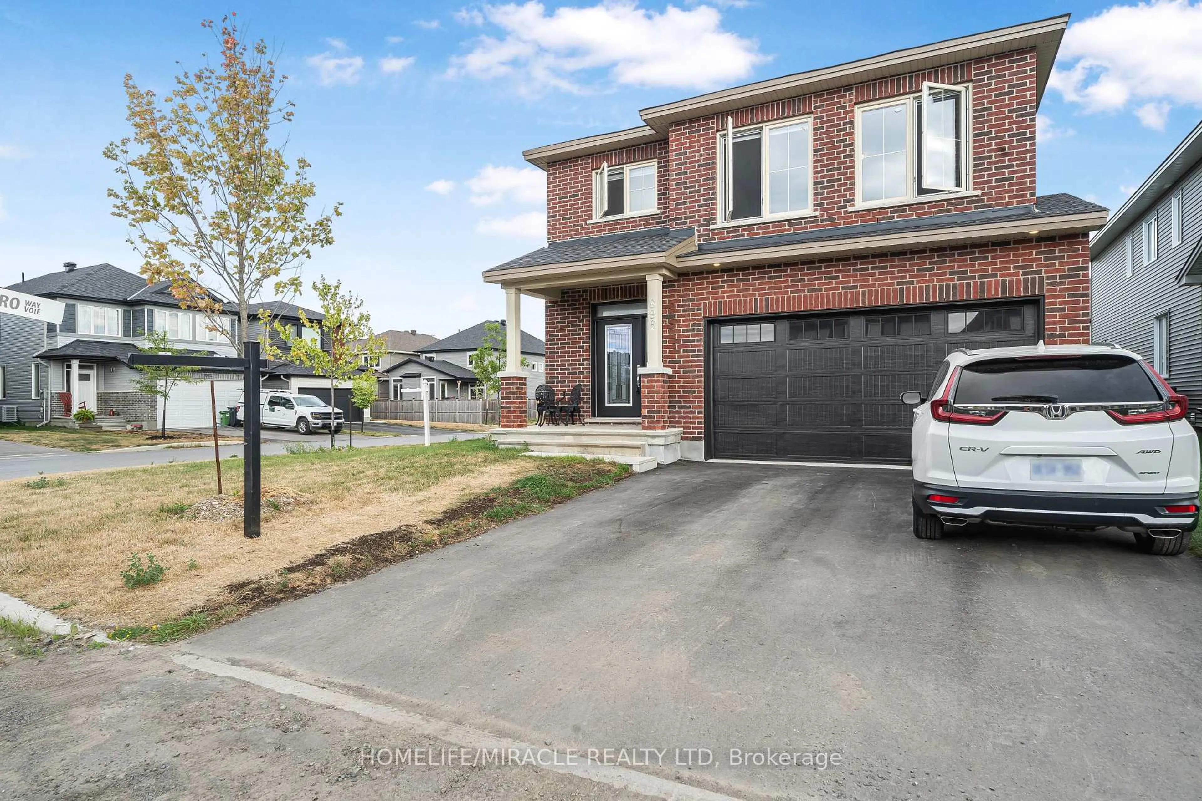 Home with brick exterior material, street for 896 Sendero Way, Stittsville Ontario K2S 2W8
