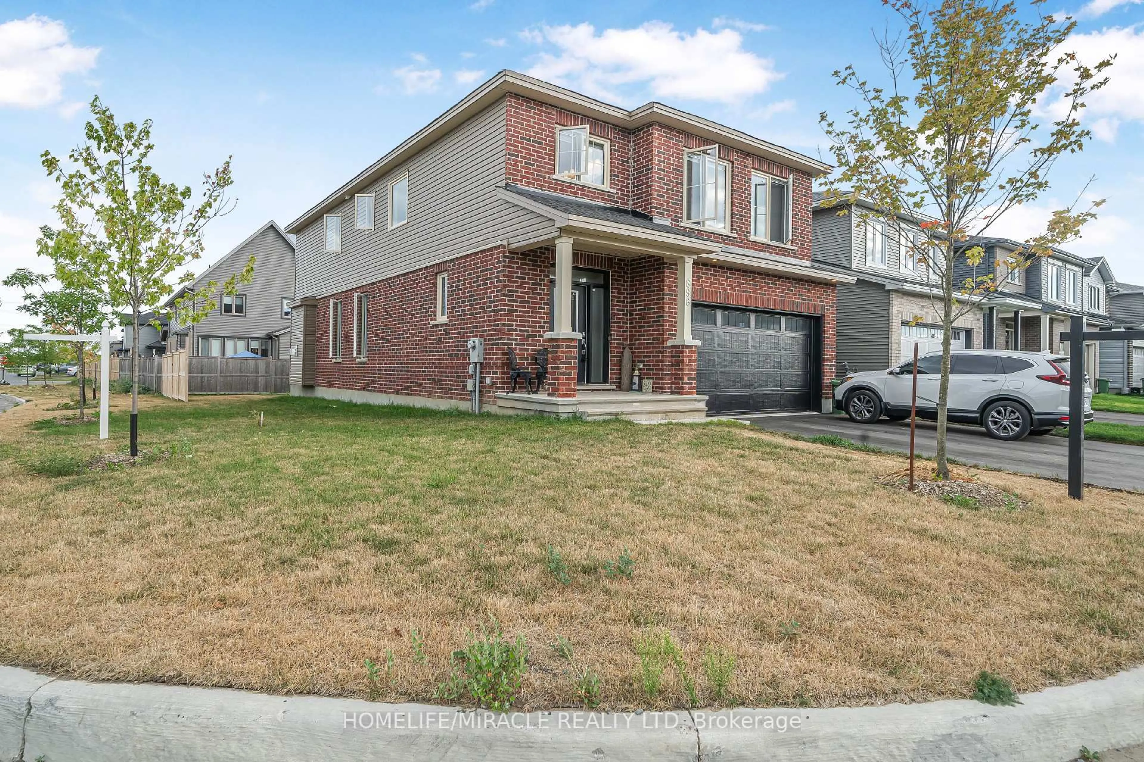 Home with brick exterior material, street for 896 Sendero Way, Stittsville Ontario K2S 2W8