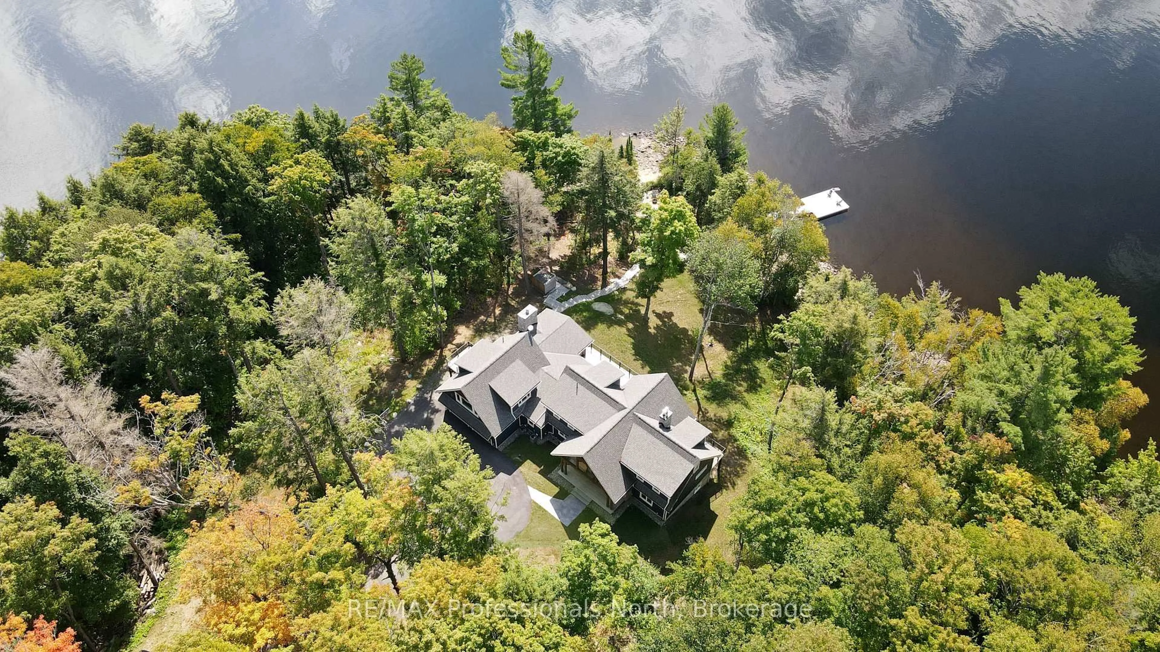A pic from outside/outdoor area/front of a property/back of a property/a pic from drone, water/lake/river/ocean view for 1394 Flatwater Cove Tr, Dysart et al Ontario K0M 1S0
