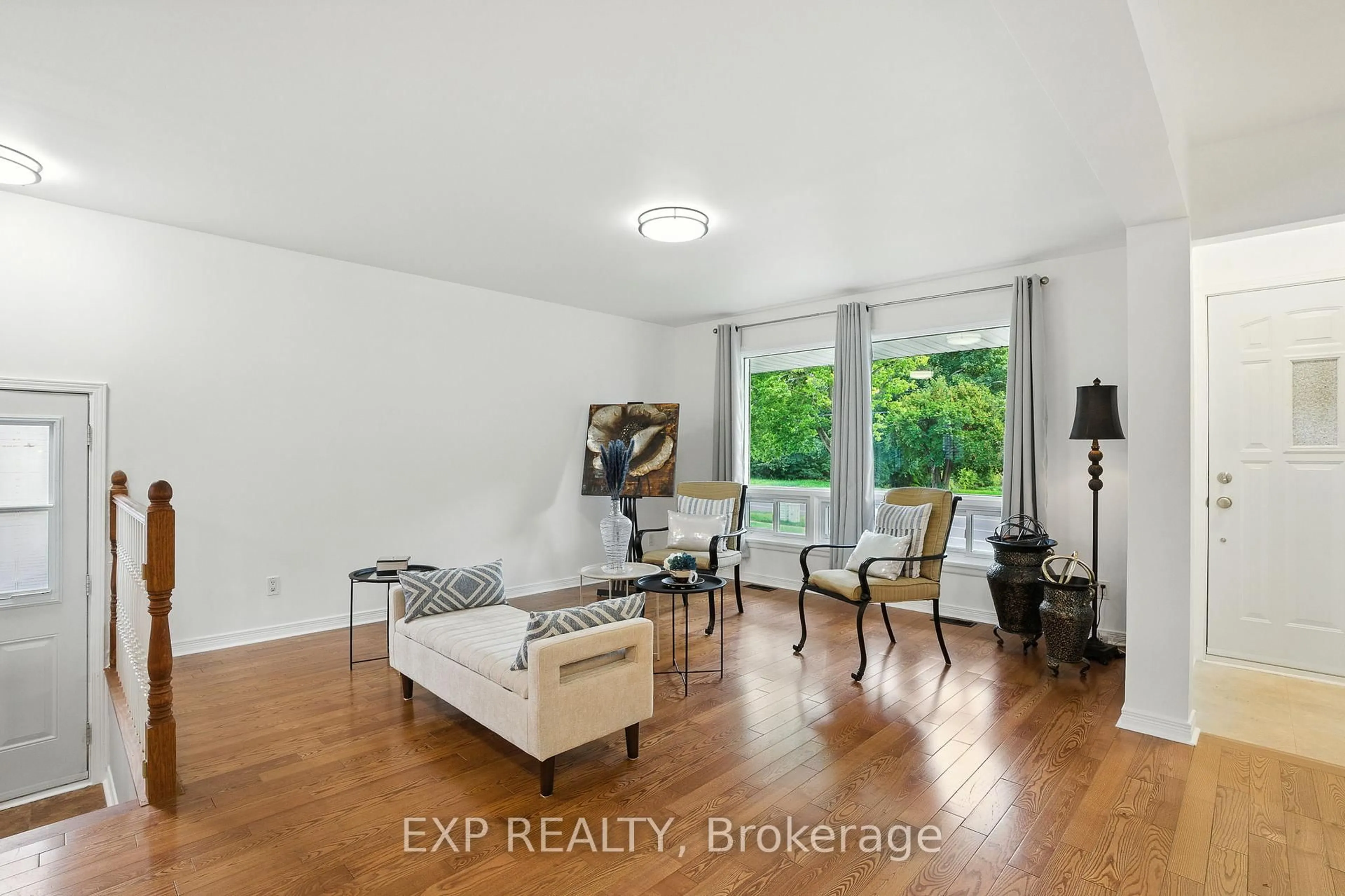 Living room with furniture, wood/laminate floor for 1419 Second St, Cornwall Ontario K6J 1J4