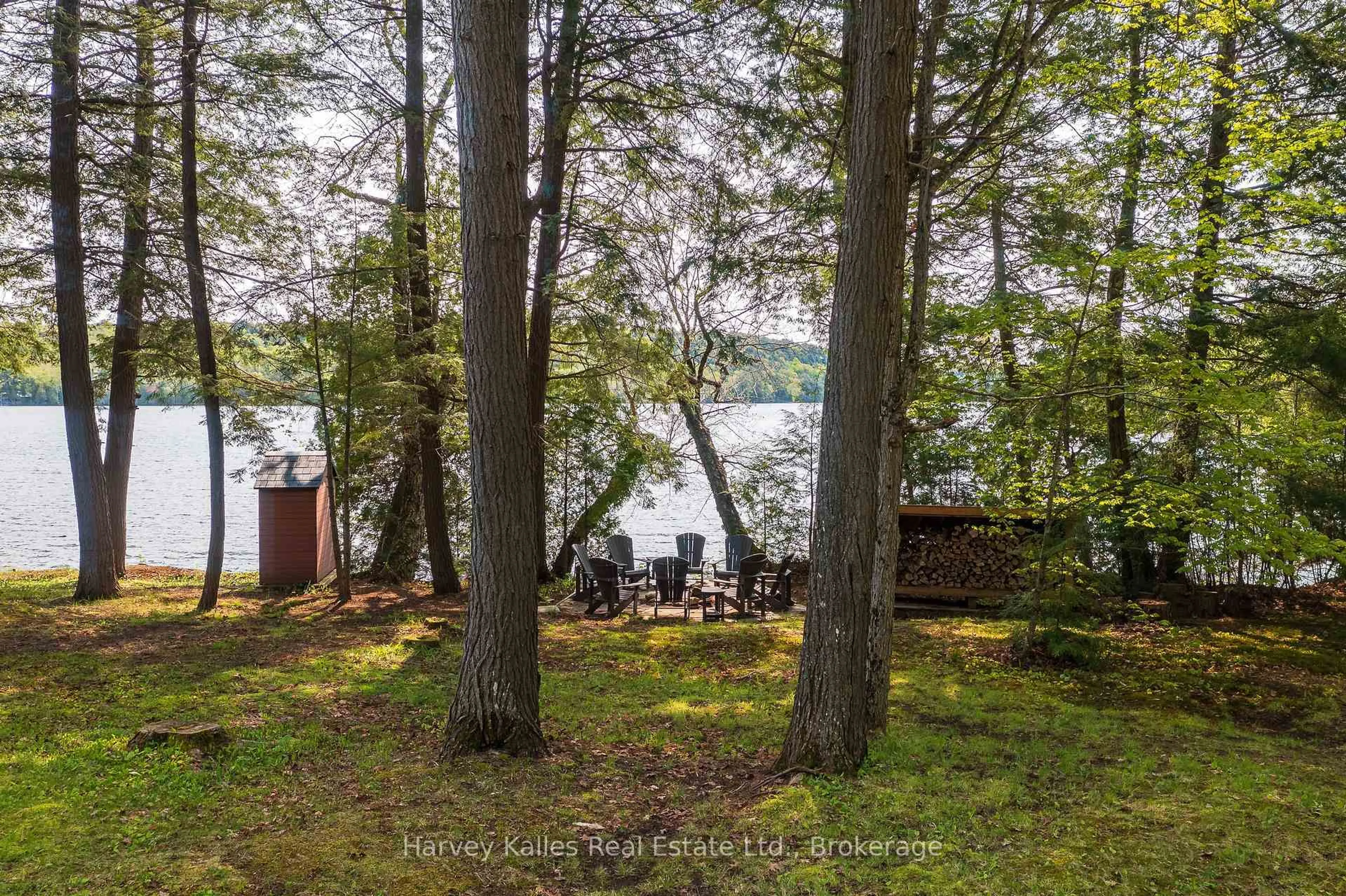 A pic from outside/outdoor area/front of a property/back of a property/a pic from drone, water/lake/river/ocean view for 1033 Scott Lane, Lake of Bays Ontario P1H 2J6
