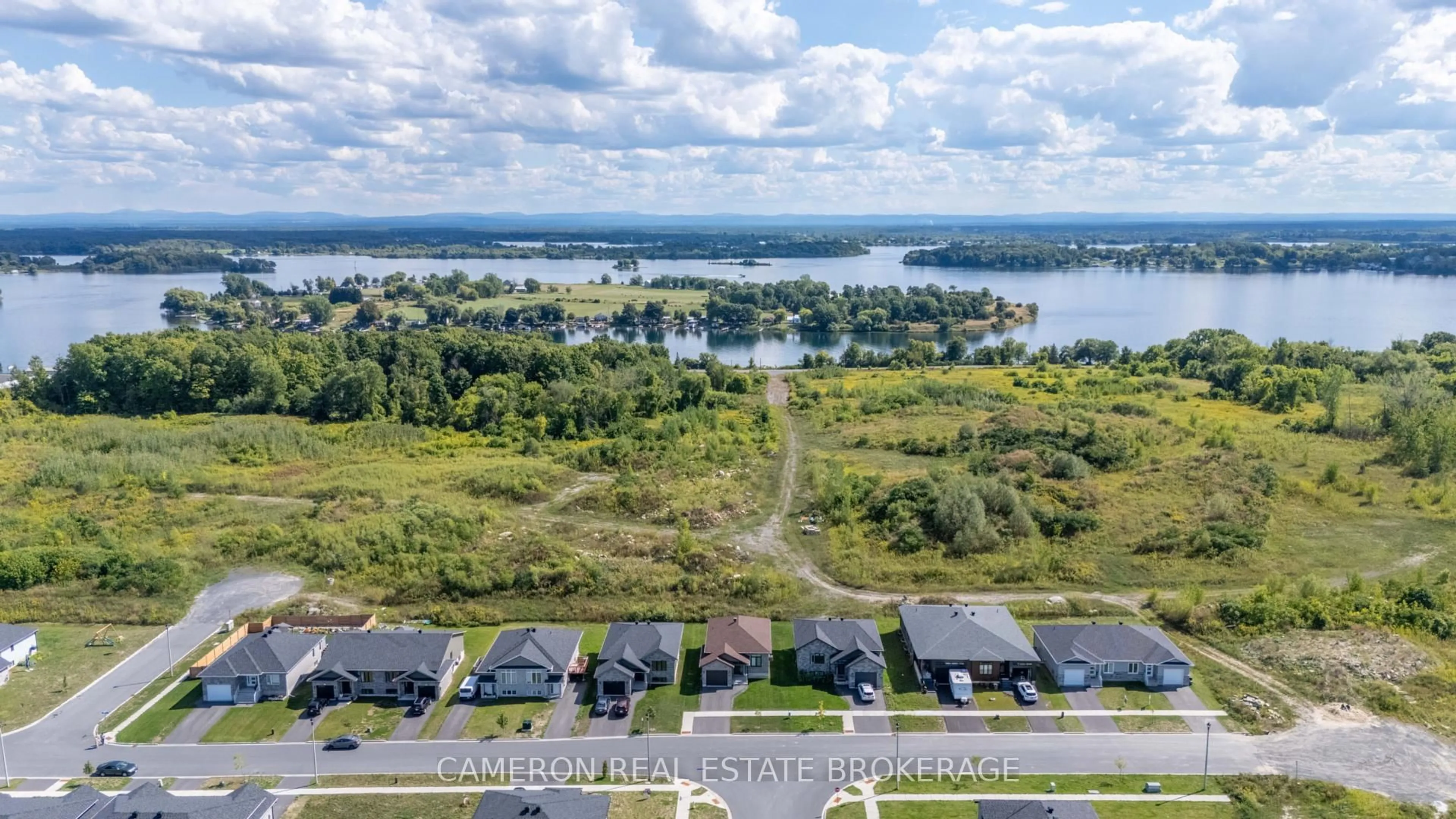 A pic from outside/outdoor area/front of a property/back of a property/a pic from drone, water/lake/river/ocean view for 2296 Crewson Crt, Cornwall Ontario K6H 7N2
