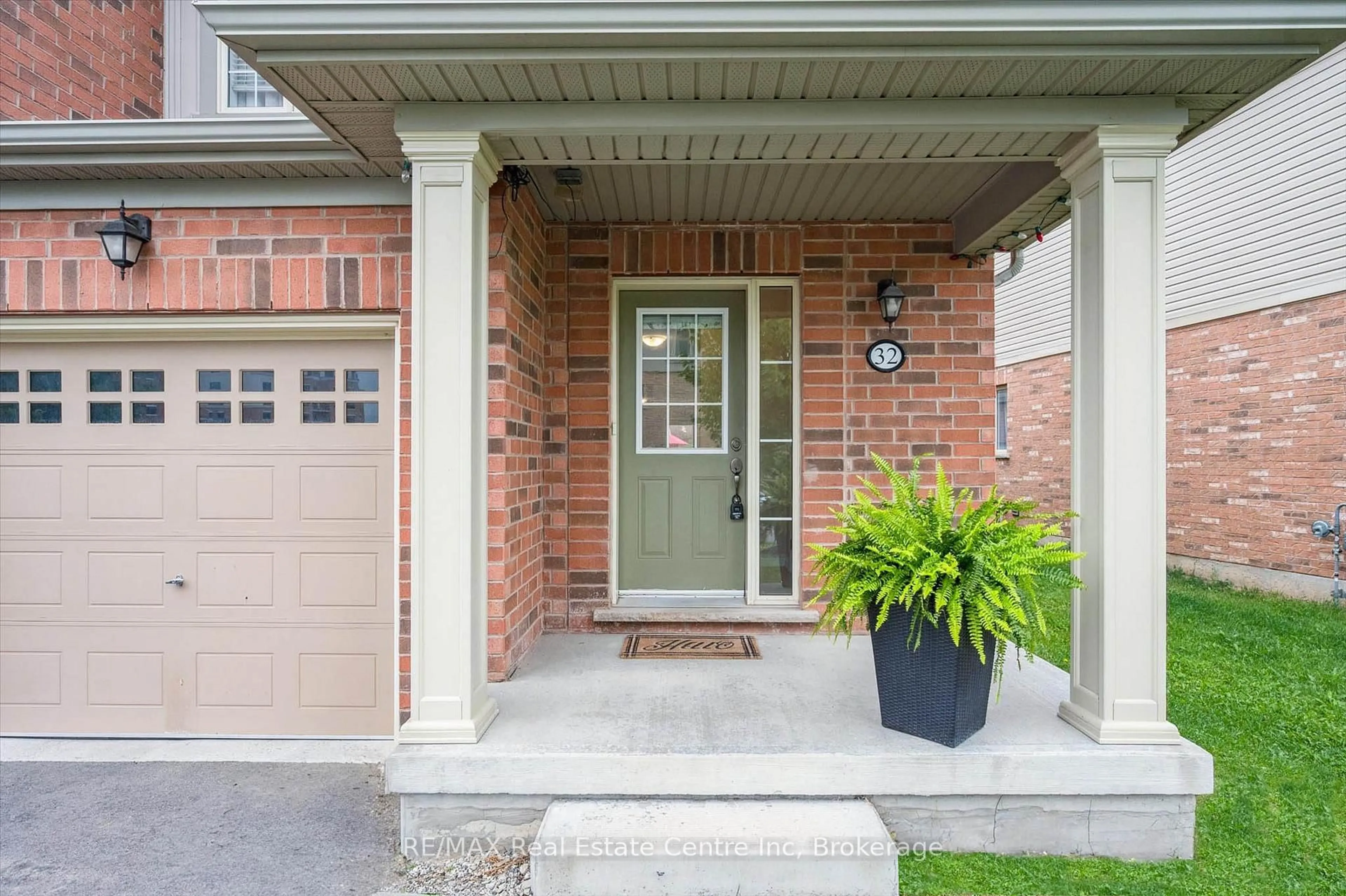 Home with brick exterior material, street for 32 Skinner Dr, Guelph Ontario N1E 0P7