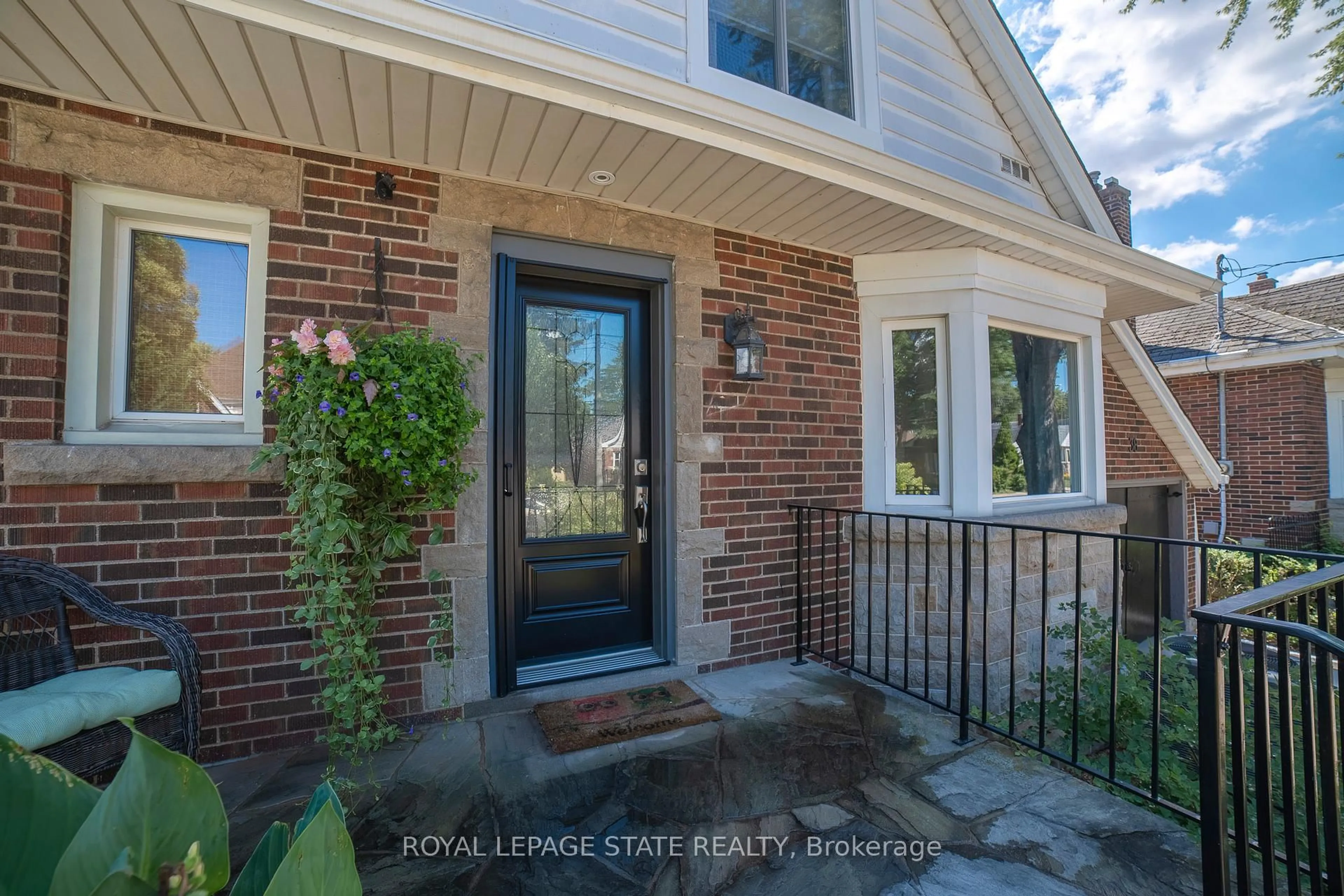 Home with brick exterior material, street for 38 Kenmore Rd, Hamilton Ontario L8S 3T7