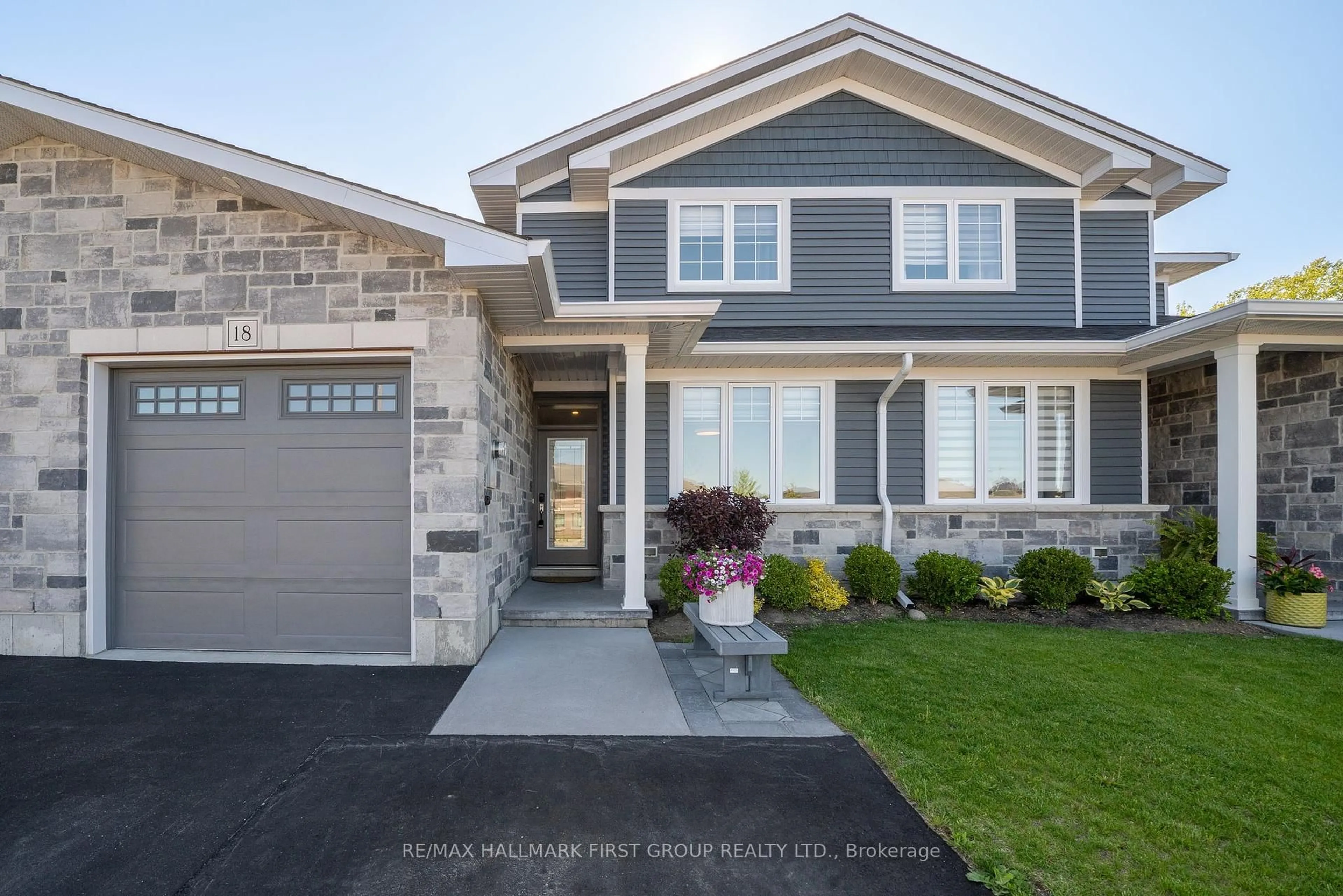 Home with vinyl exterior material, street for 18 Stinson Ave, Belleville Ontario K8P 5N9