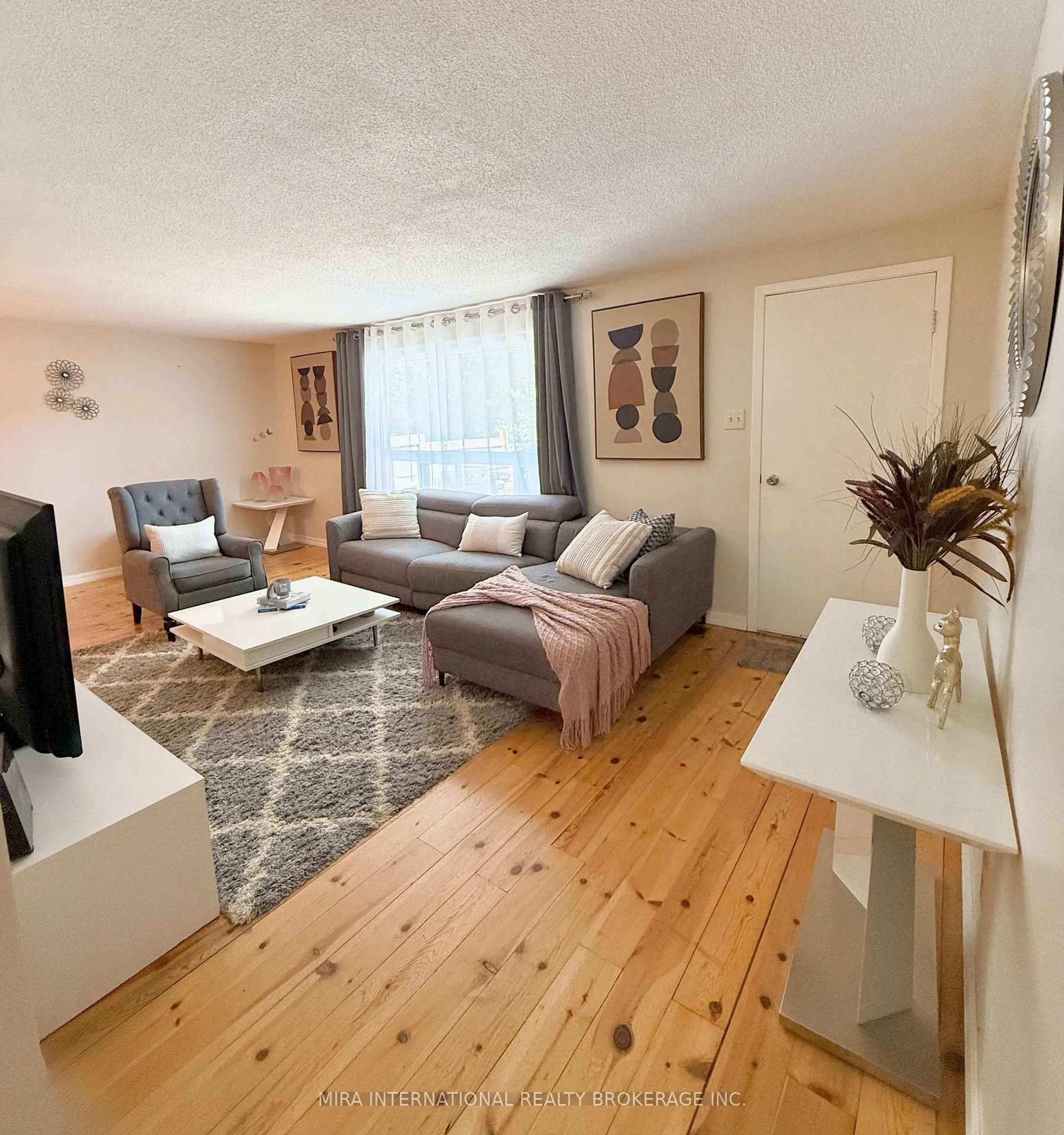 Living room with furniture, wood/laminate floor for 280 Thaler Ave #34, Kitchener Ontario N2A 1R6