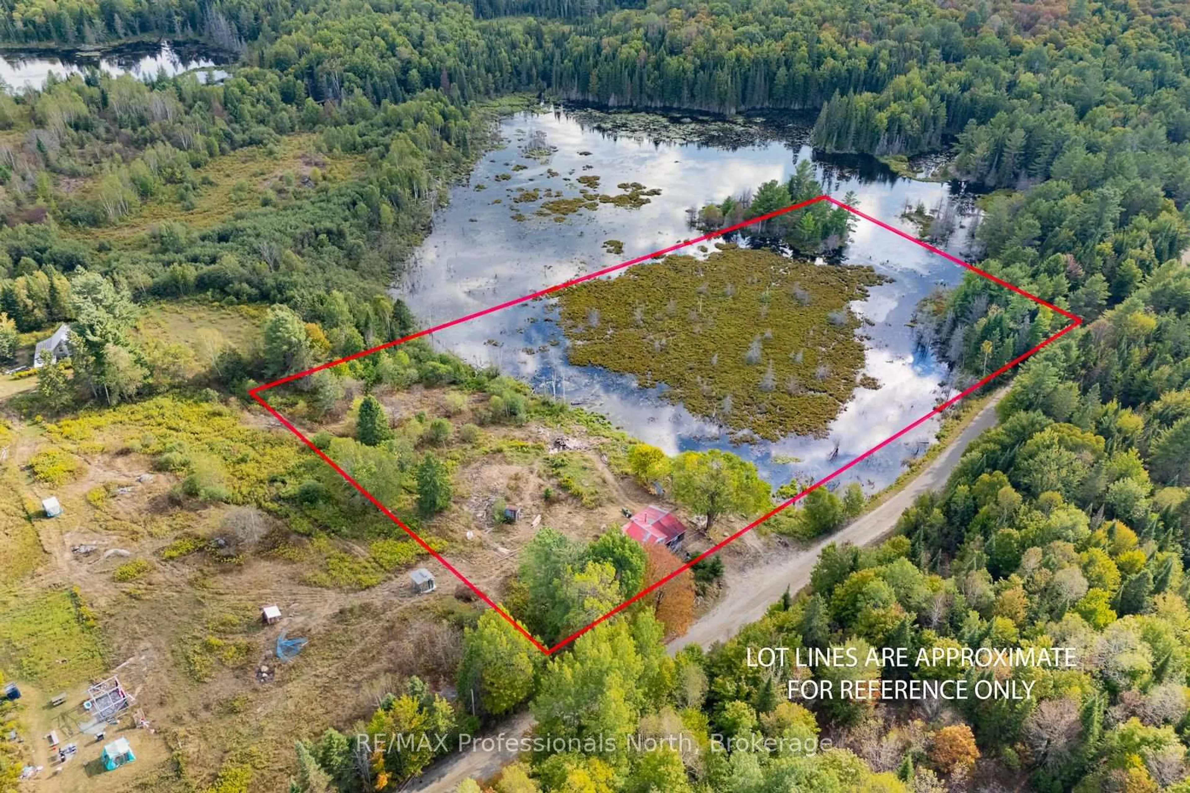 A pic from outside/outdoor area/front of a property/back of a property/a pic from drone, water/lake/river/ocean view for 1127 Fallowfield Rd, Highlands East Ontario K0M 1S0