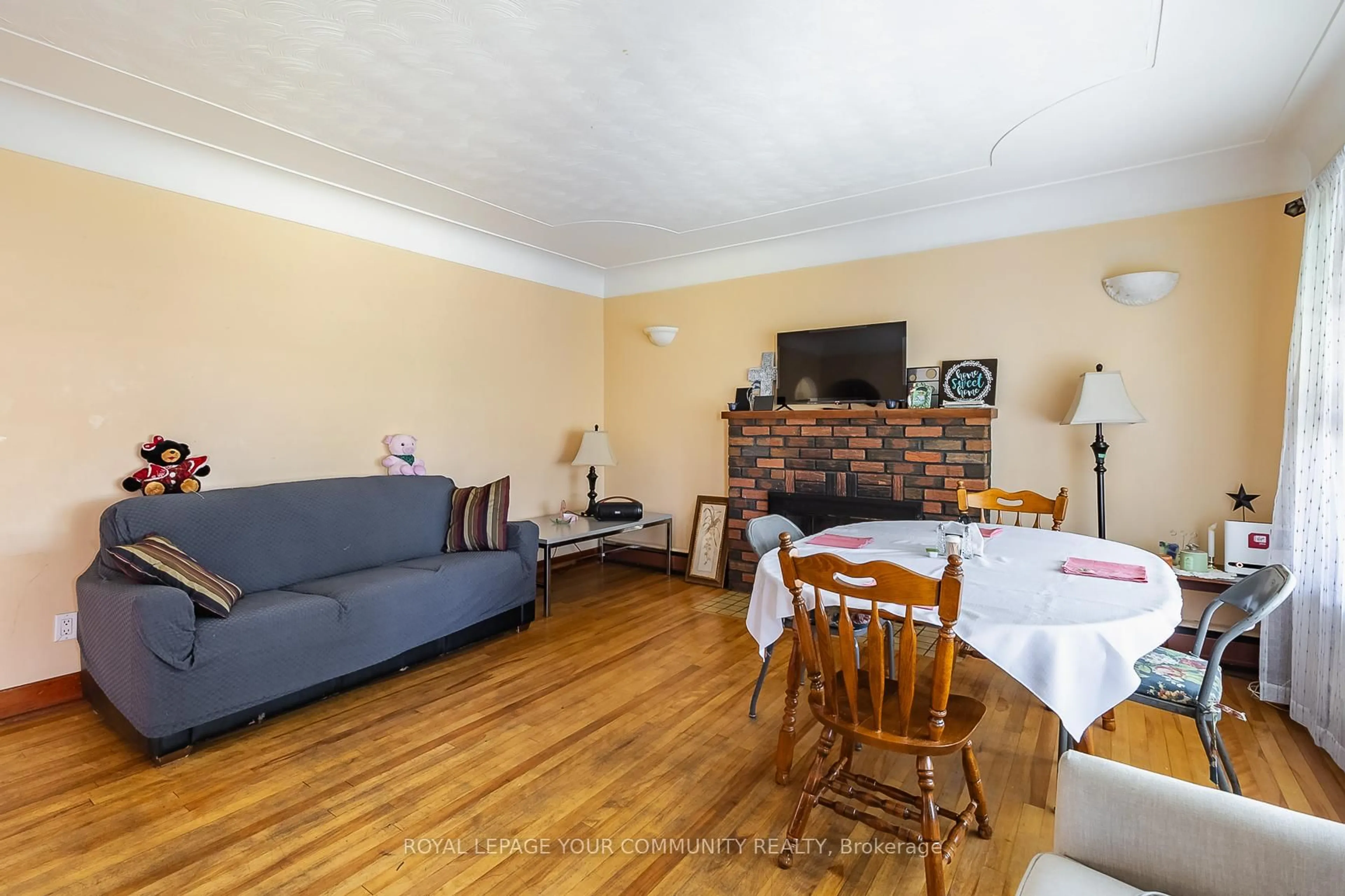 Living room with furniture, wood/laminate floor for 928 Great Northern Rd, Sault Ste Marie Ontario P6B 5A3