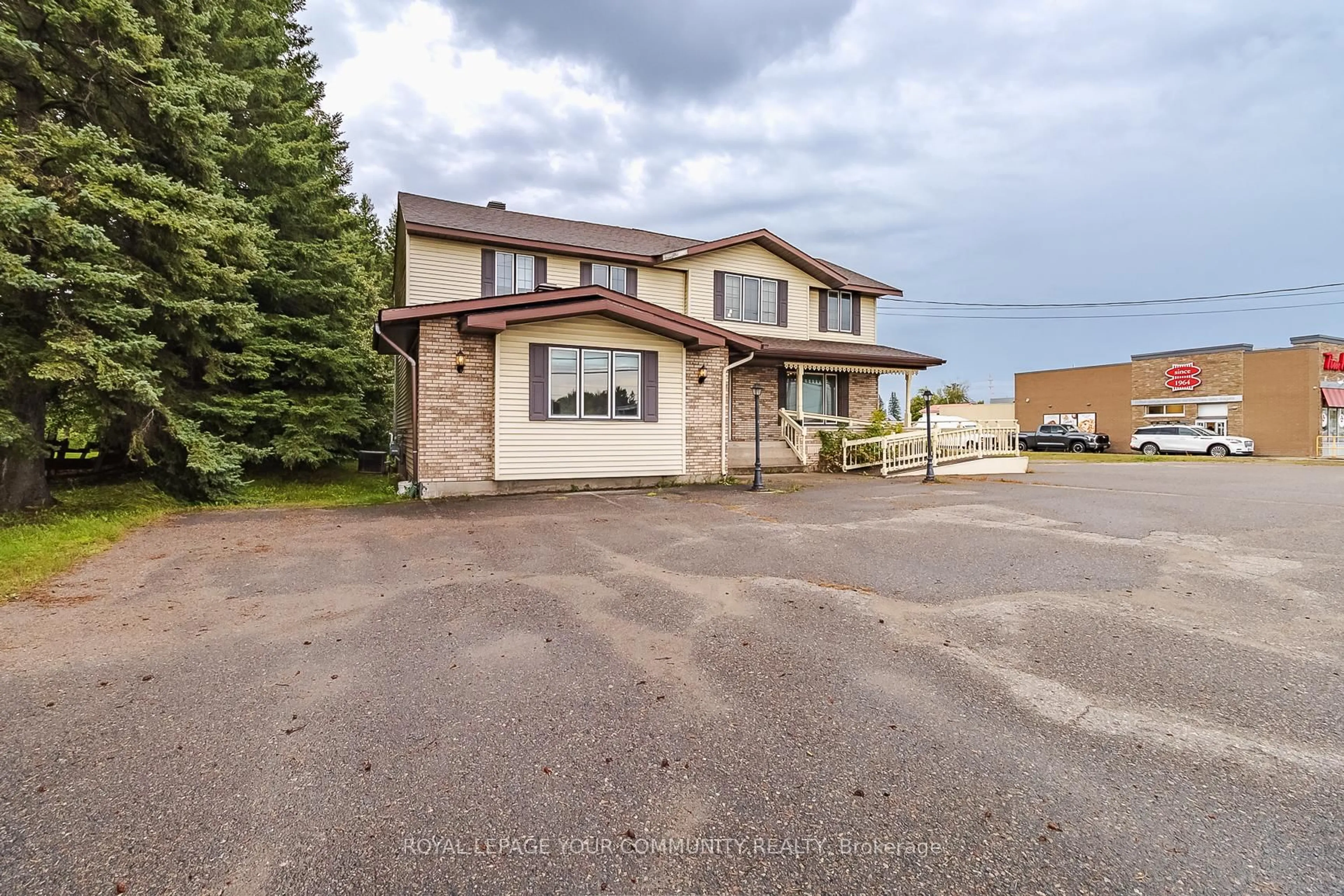 A pic from outside/outdoor area/front of a property/back of a property/a pic from drone, street for 920 Great Northern Rd, Sault Ste Marie Ontario P6B 0B6