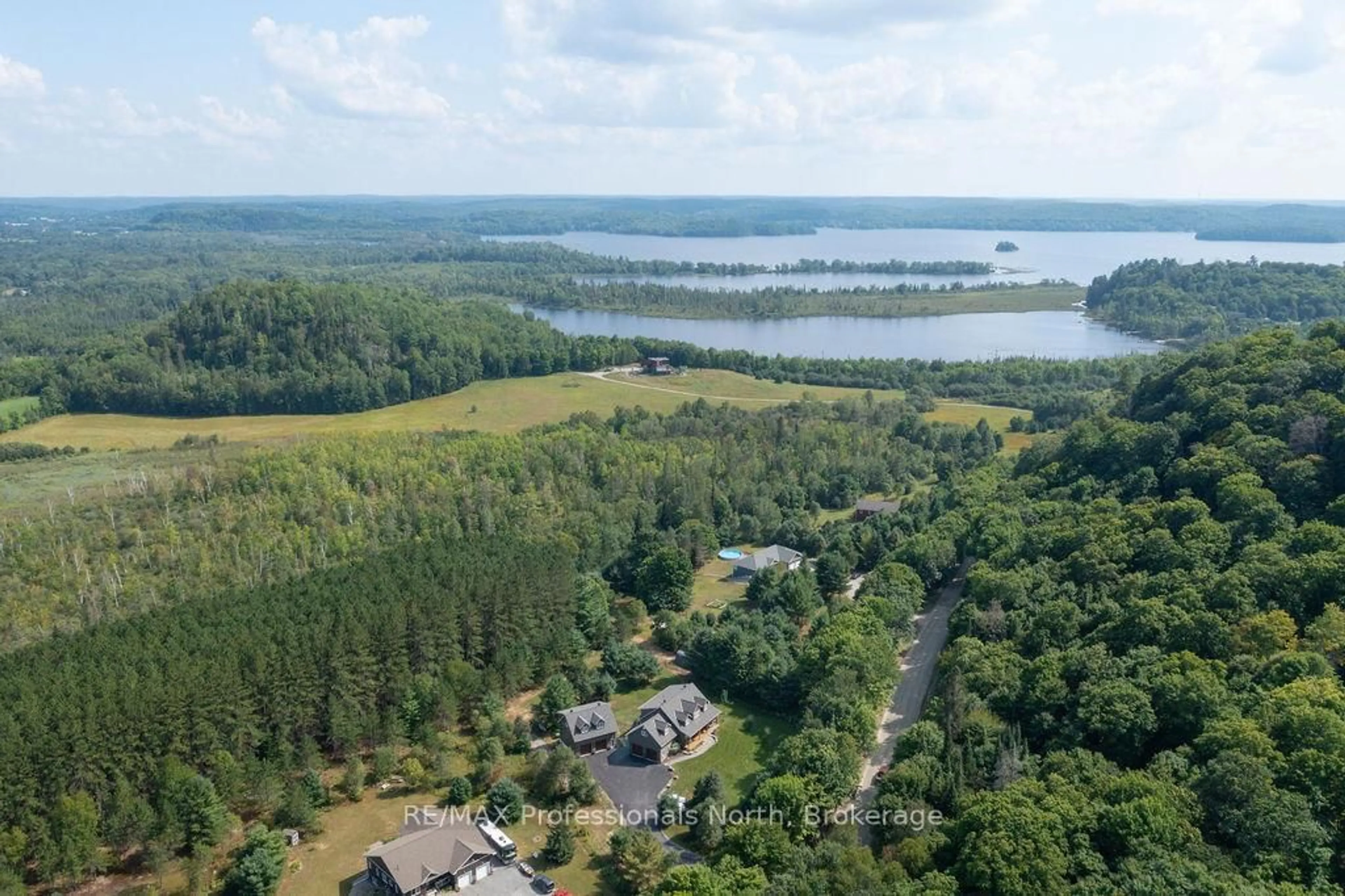 A pic from outside/outdoor area/front of a property/back of a property/a pic from drone, water/lake/river/ocean view for 427 Skyhills Rd, Huntsville Ontario P1H 2N5