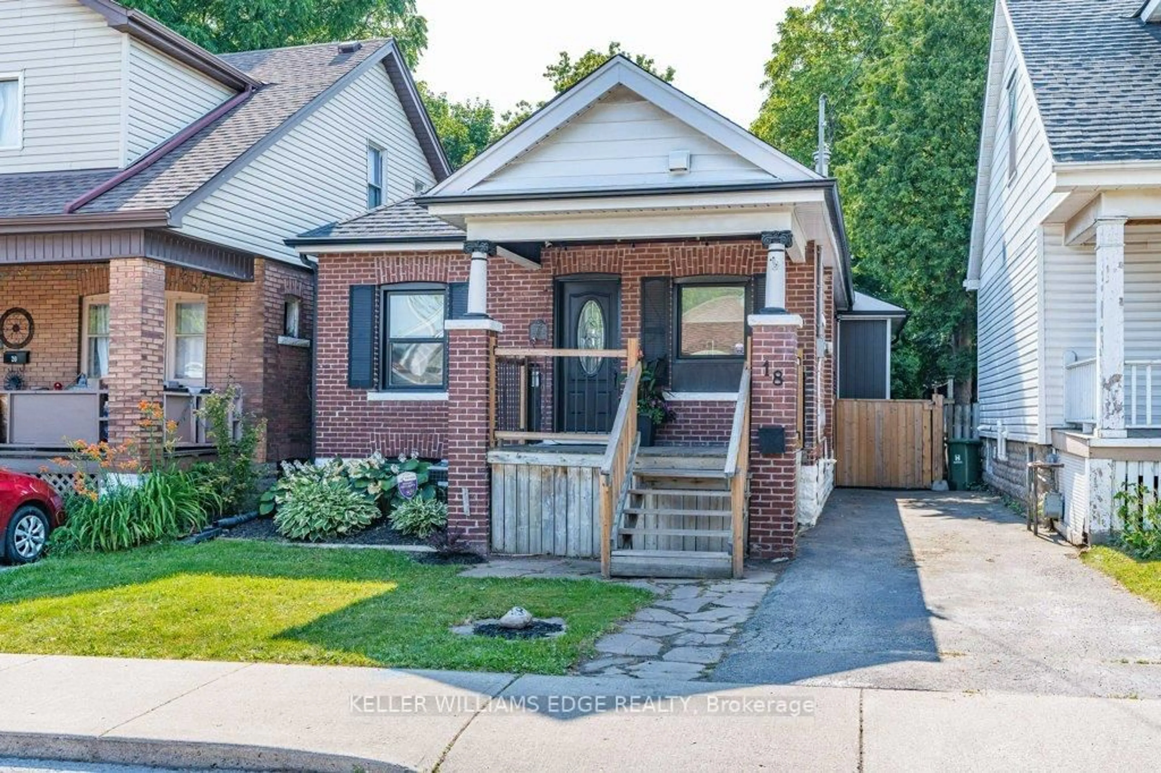 Home with brick exterior material, street for 18 Park Row, Hamilton Ontario L8H 4E4