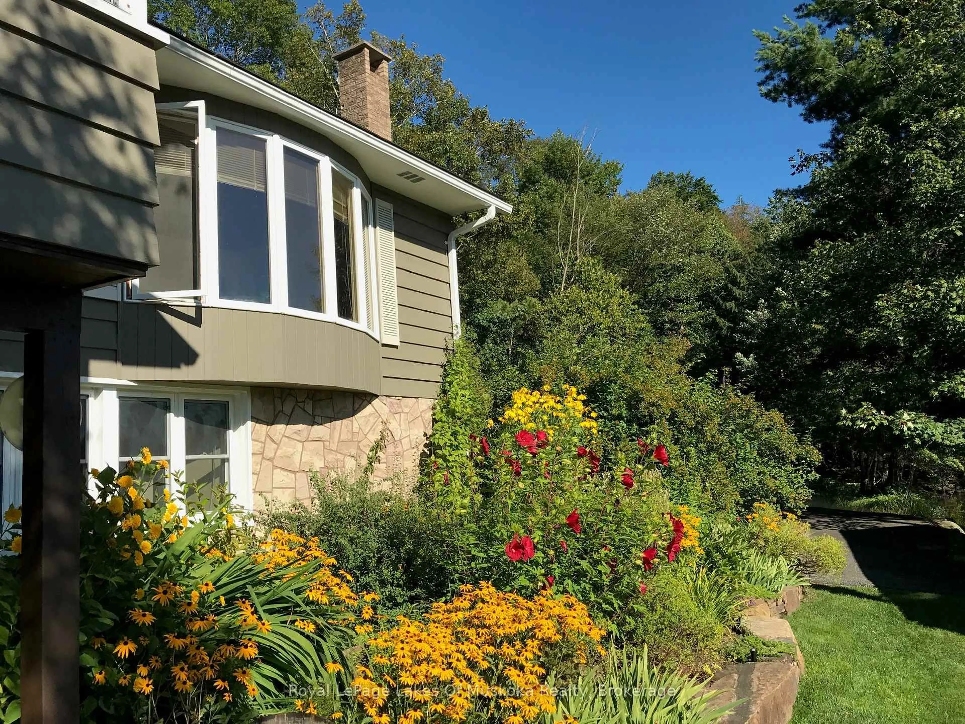 A pic from outside/outdoor area/front of a property/back of a property/a pic from drone, unknown for 1027 Old Bridge Rd #4, Muskoka Lakes Ontario P0B 1J0