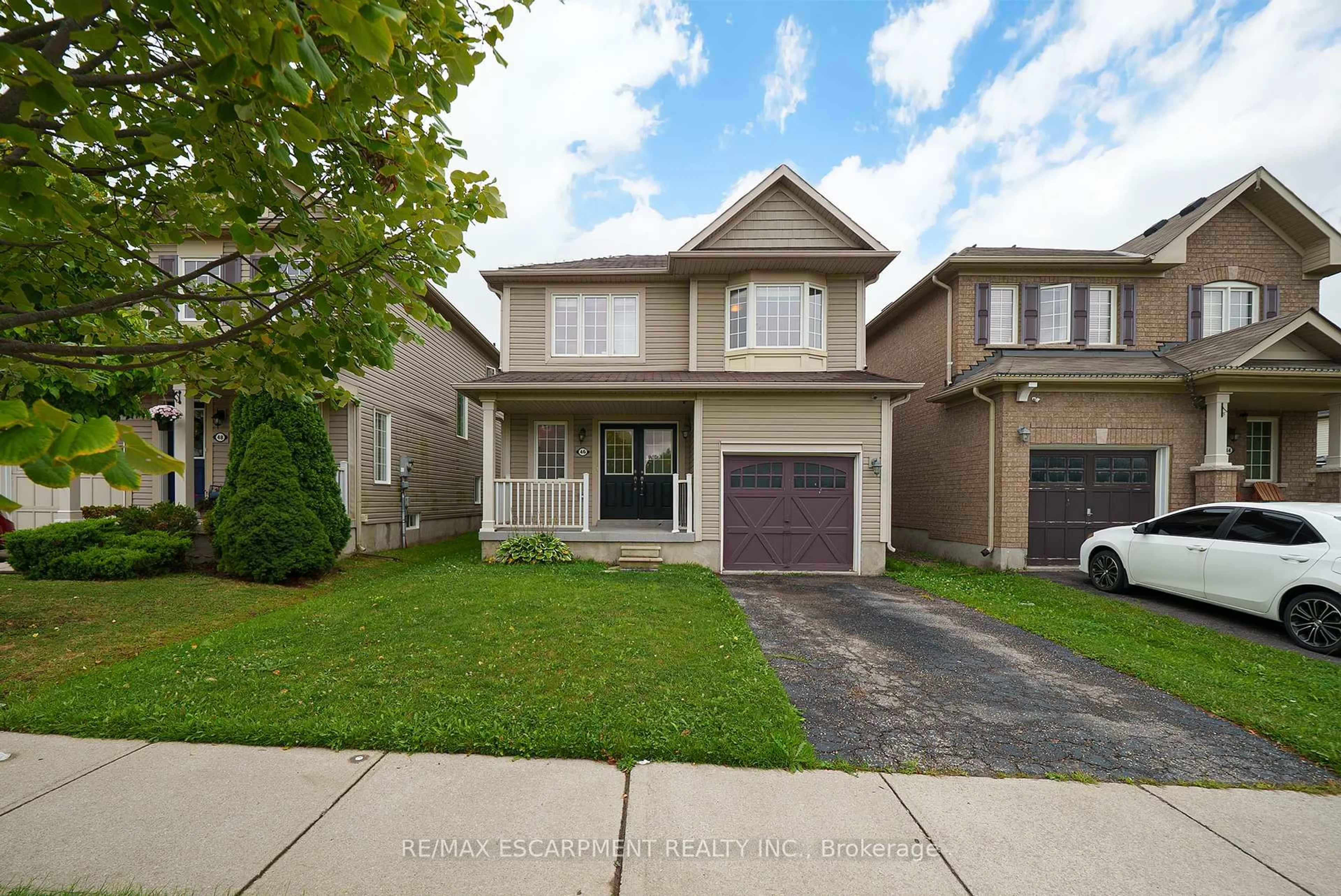 Home with vinyl exterior material, street for 46 Warner Lane, Brantford Ontario N3T 0E7