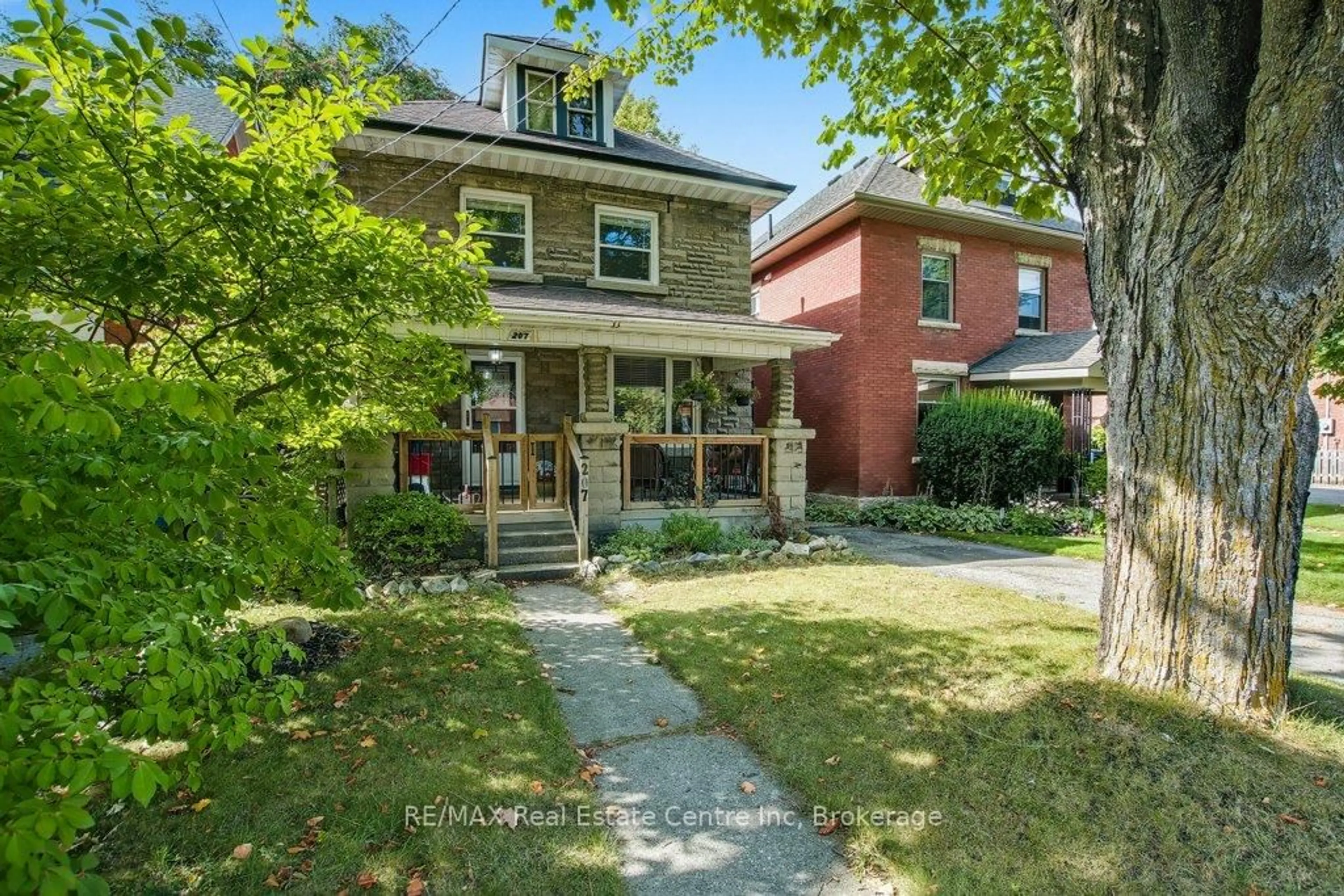 Home with brick exterior material, street for 207 Waterloo Ave, Guelph Ontario N1H 3J4